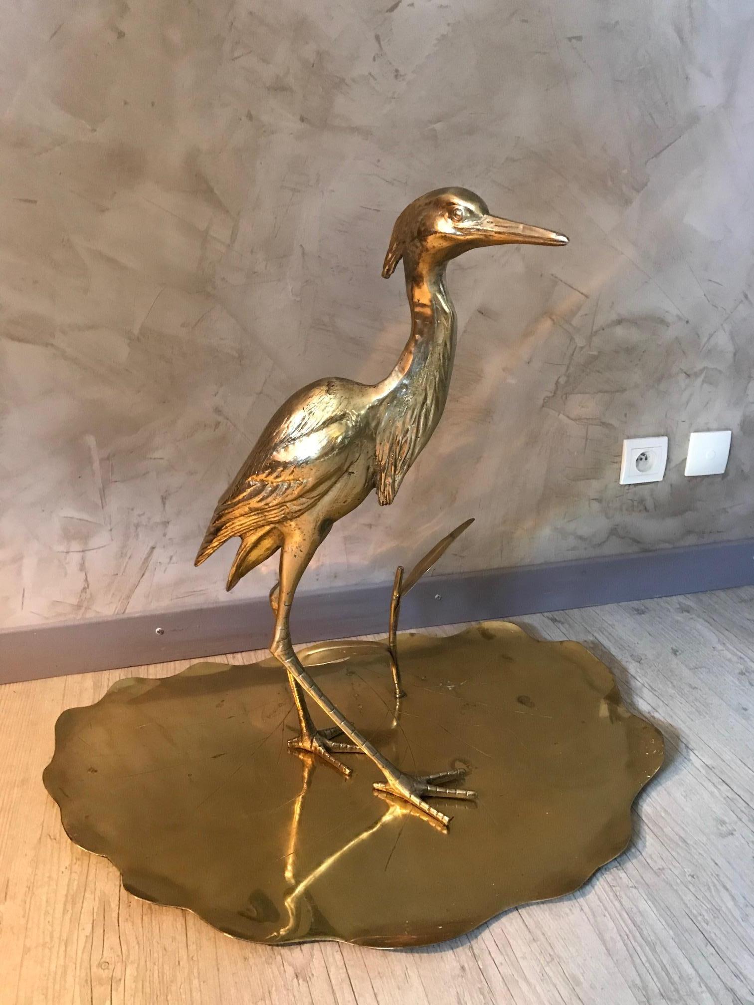 Beautiful 20th century French decorative brass heron on a brass nenuphar base from the 1950s.
One heron leg has been restored but you cannot see the restoration.
Very nice decorative piece.
  