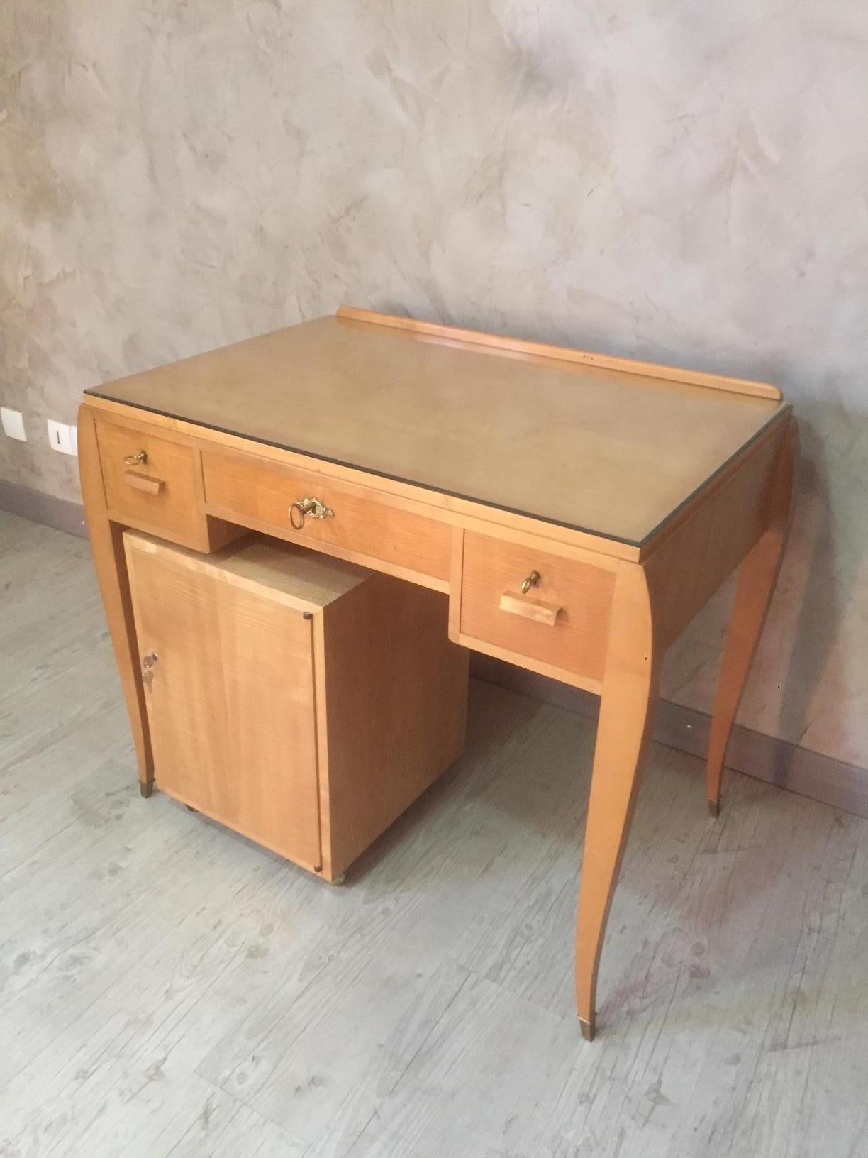Very nice 20th century French desk with a rolling drawer from the 1950s.
There is a glass top. Three drawers with originals keys. gilded brass fitting.
 