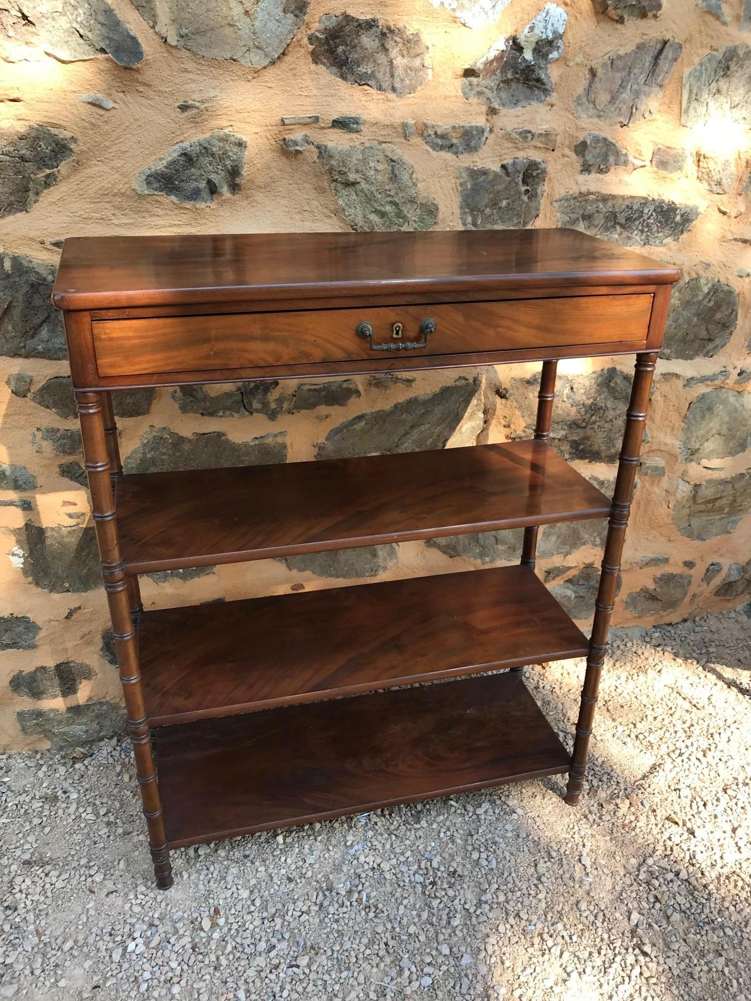 Beautiful 20th century French Directoire style mahogany console table from the 1920s.
Large drawer. Three shelves.