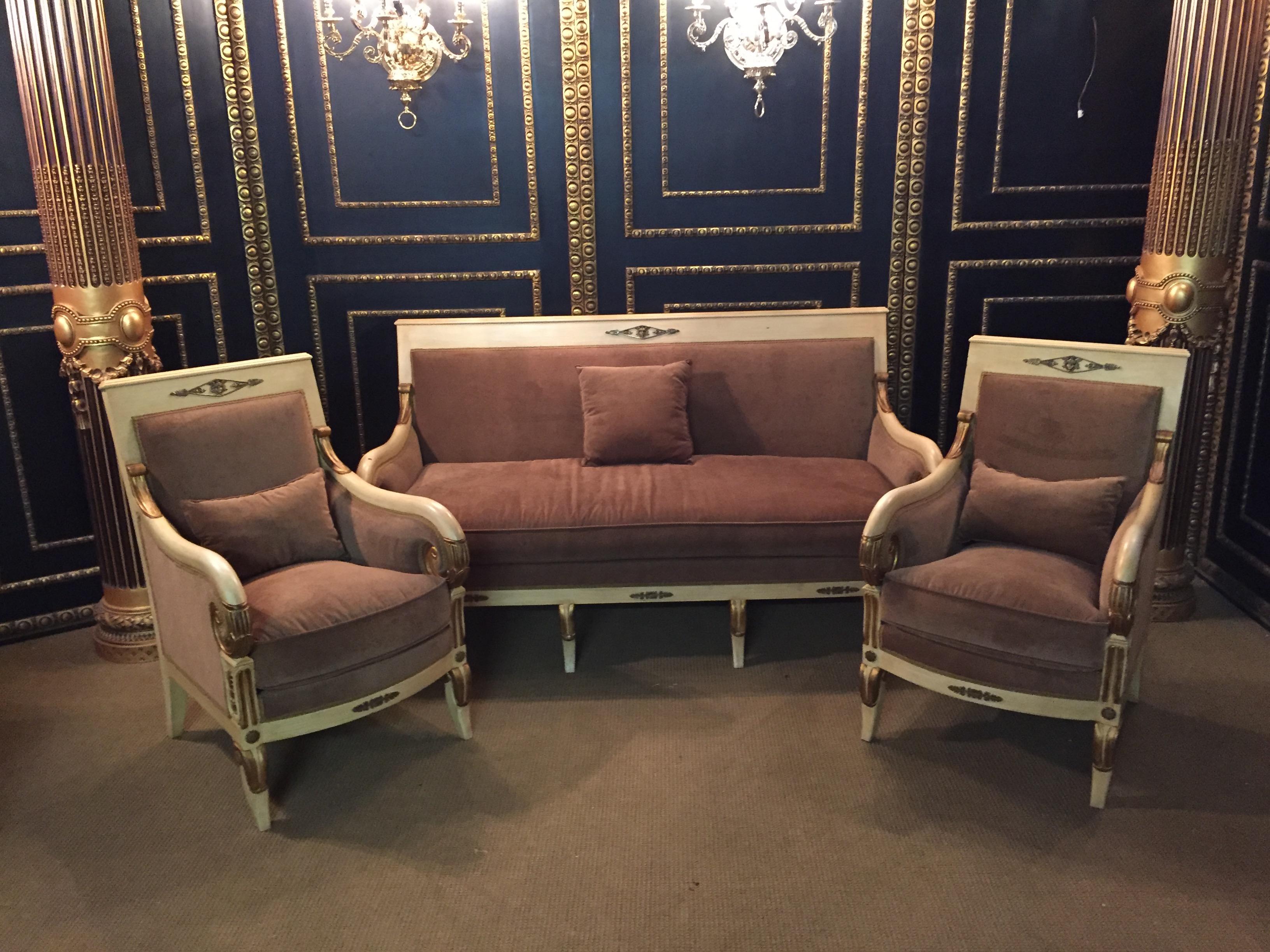 Please contact us for more pictures of the sofa and the armchairs.
Solid beechwood, carved, colored and gilded.

Cambered frame on curly legs. Braced supports for slightly rising armrests ending in rolled-up volutes.
High-rimmed, slightly curved