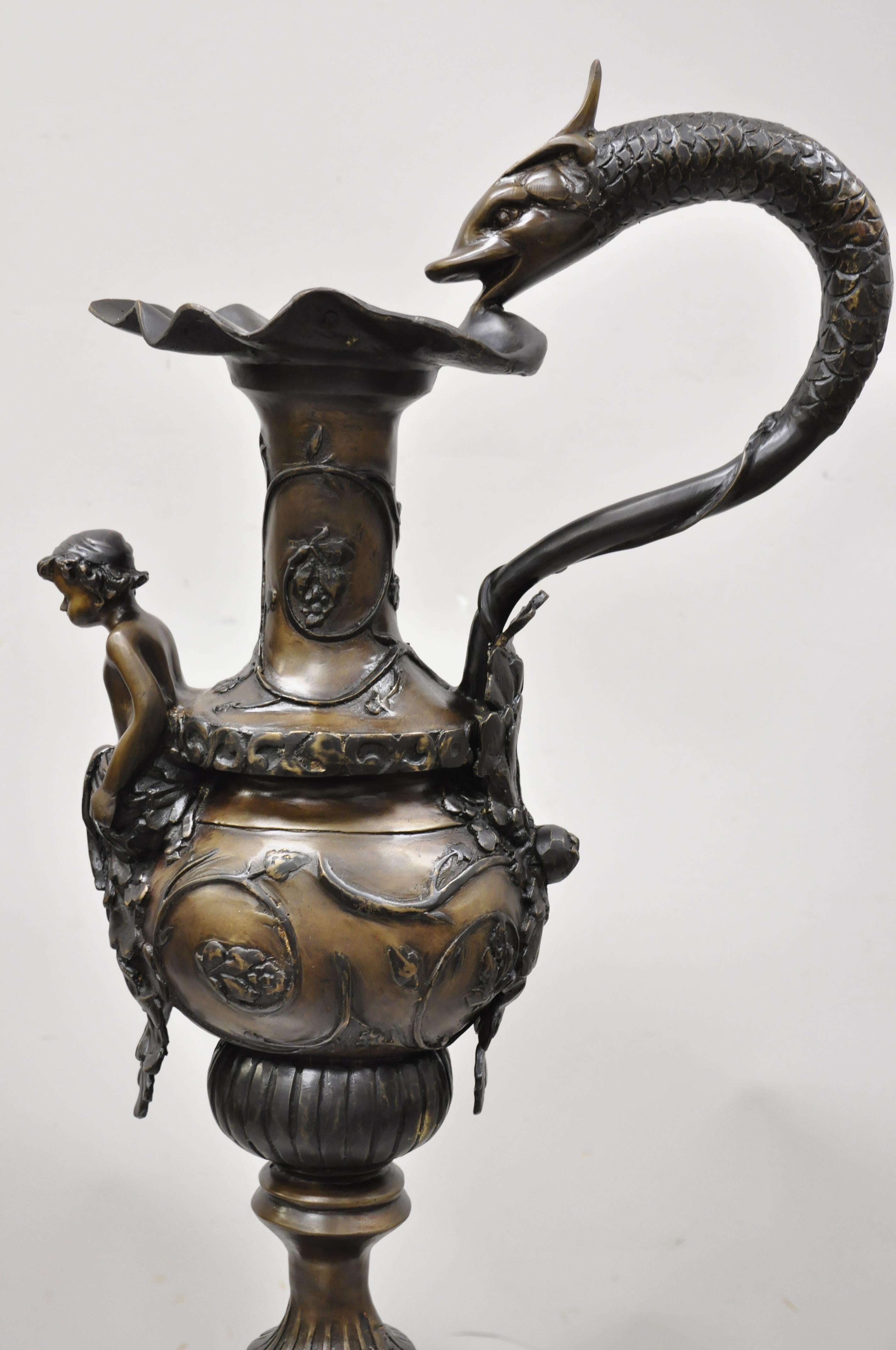 20th century French Empire style large figural bronze urn ewer vase with cherub. Item features a serpent handle, seated cherub, large impressive size, great style and form. Weighs approximate 30 lbs, circa late 20th-21st century. Measurements: 31