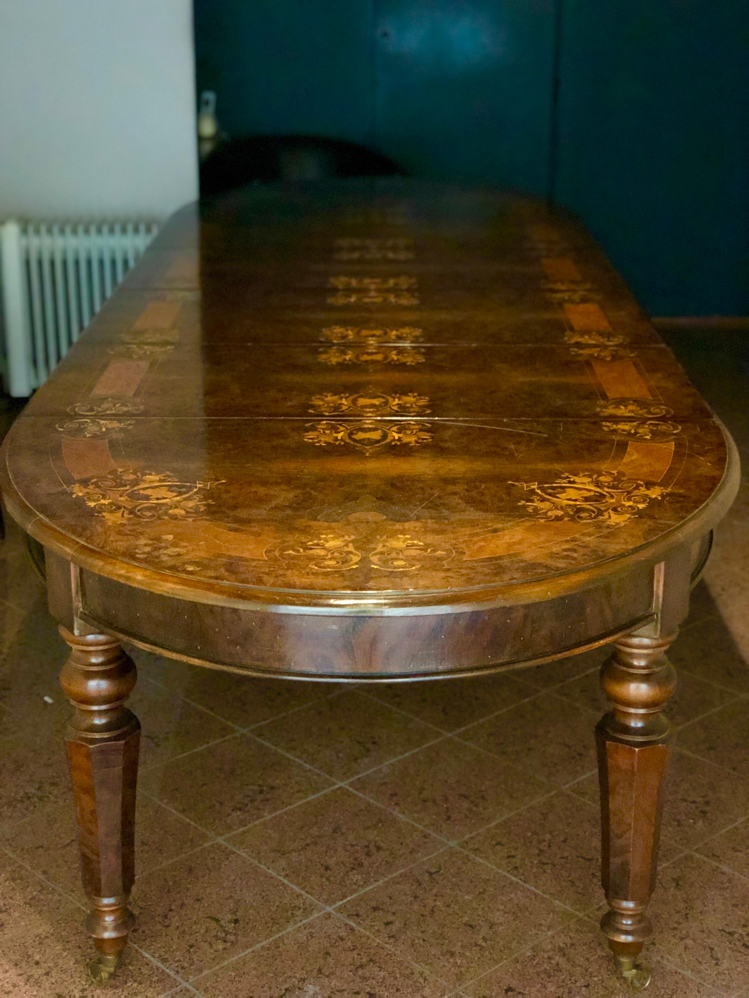 French handmade Victorian style extendable marquetry gorgeous walnut and marquetry dining room table. There are four extendable part each 52 cm width.
The table could be extended between 155 to 365 cm.
France.
    