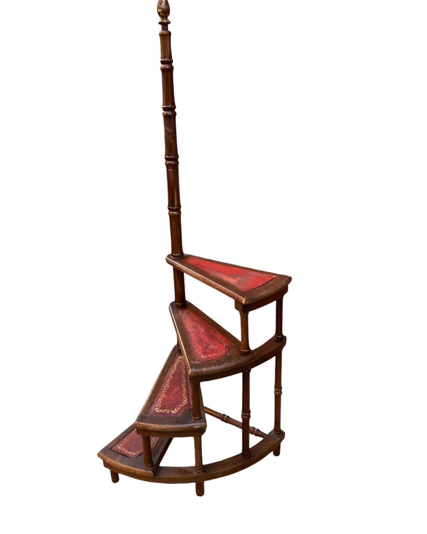 20th Century French faux bamboo wood and leather library steps. 

Circular set of 4 tiered steps features an elegant ring turned faux bamboo handrail surmounted with a round wood top with faded gold leaf

Four shaped steps witsteps with a tooled red