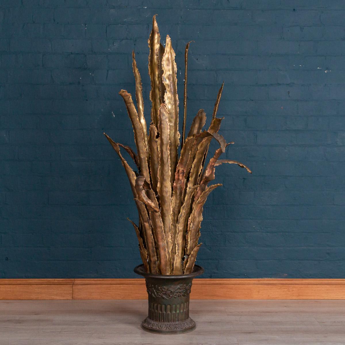 A wonderful and very decorative floor lamp in the form of a Sansevieria, with one light point in the middle at the base of the lamp. Extremely good quality and exceptionally well finished it would make a superb addition to any interior both modern