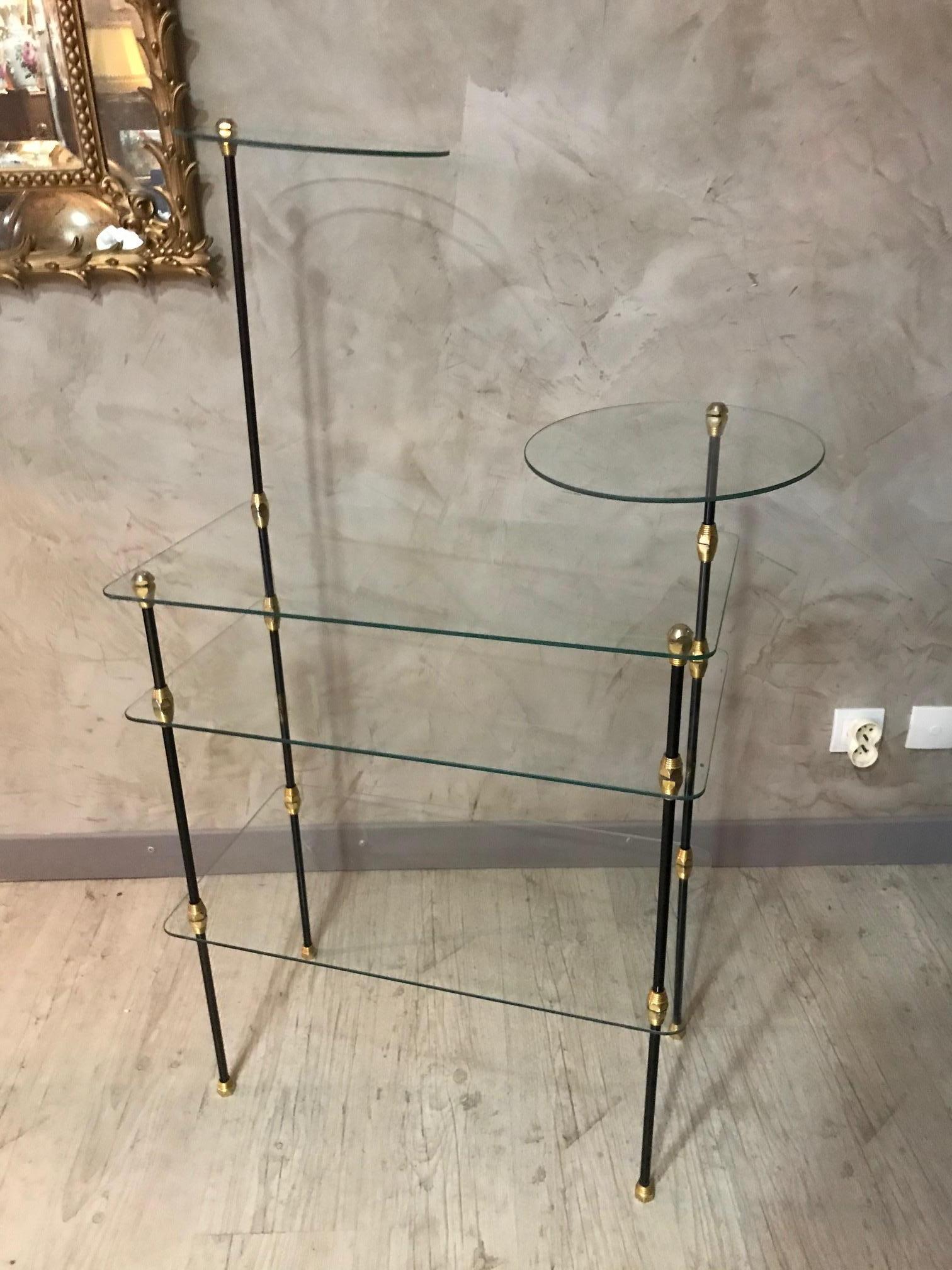Very original 20th century French gilded brass and glass shelf from the 1950s.
Can be easily disassembled.
Two rounded glass top and three rectangular glass top.
Very good quality.