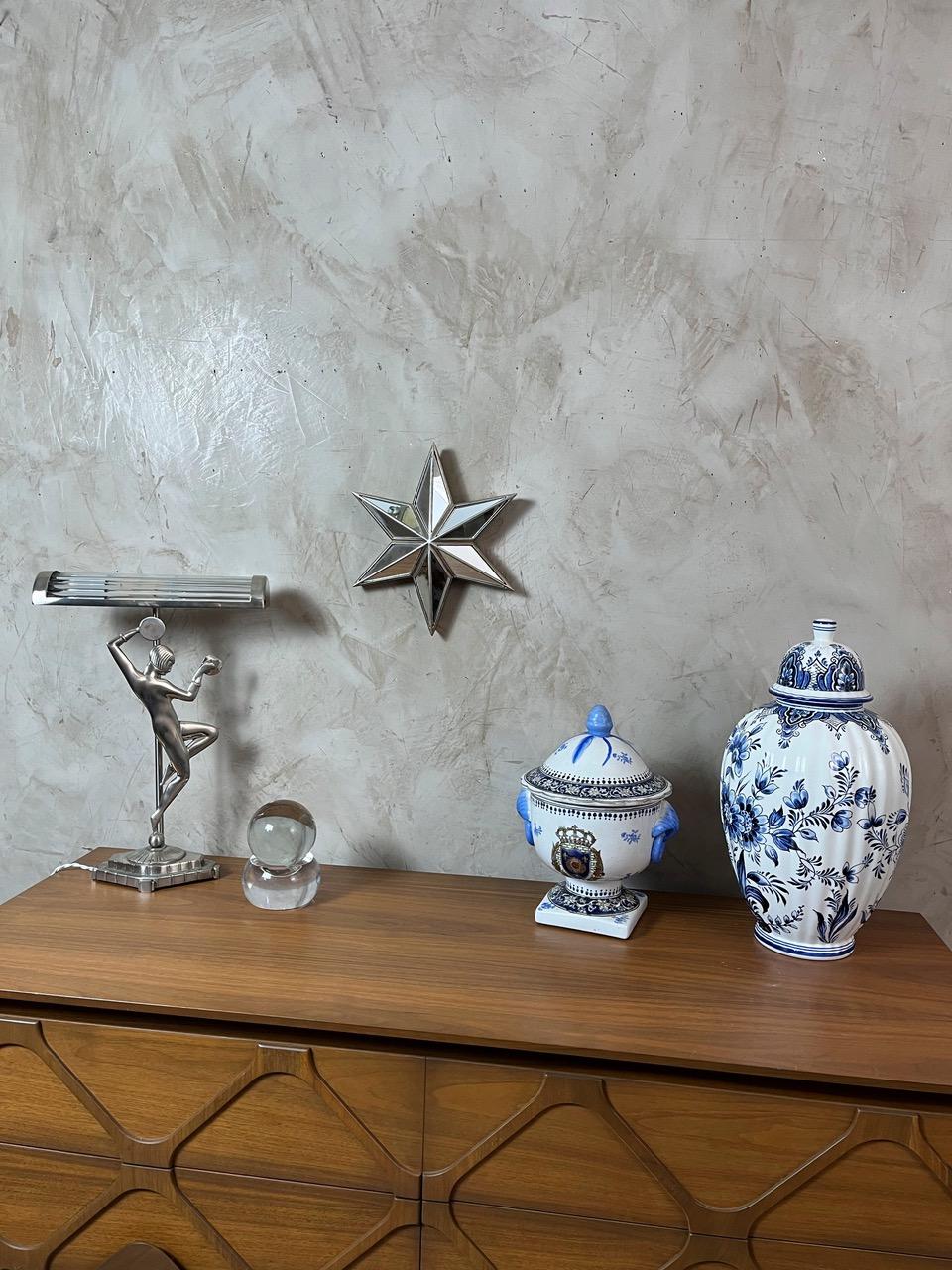 Solid Clear Glass Sphere, both modern and timeless, in the style of Baccarat. It rests on a perfectly stable rounded base, creating a minimalist sculptural effect that subtly captures the light. Delicate rainbow reflections appear depending on the