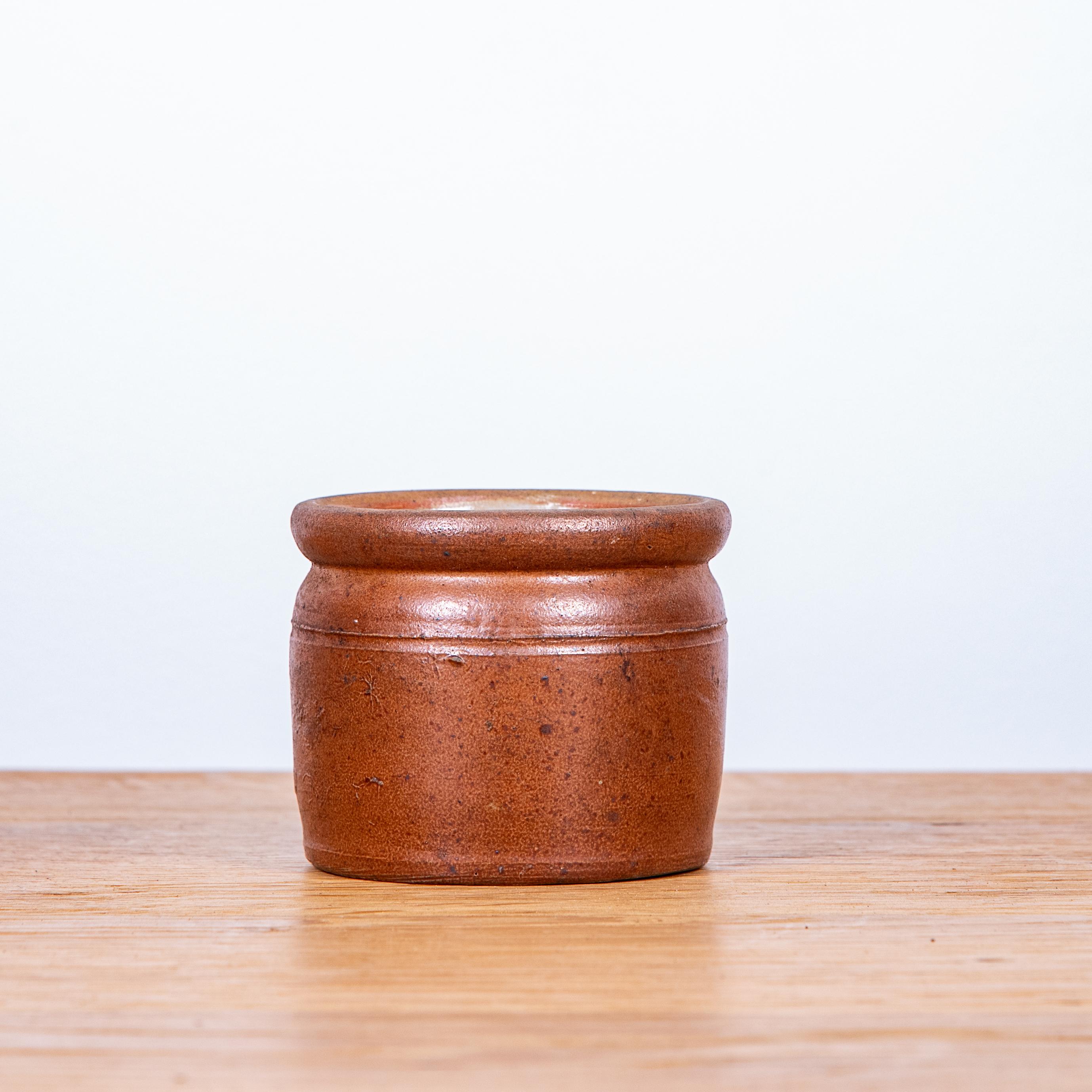 This charming 20th Century French Glazed Ceramic Pot, specifically designed for making 