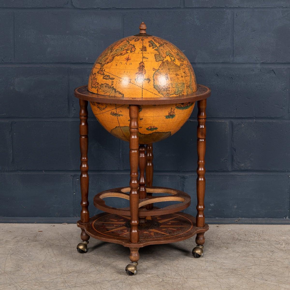 A charming old-world portable globe bar, crafted in France in the late 20th century, likely during the 1970s. It captures the essence of vintage sophistication and functionality. Although designed with modern materials, the bar is wrapped in