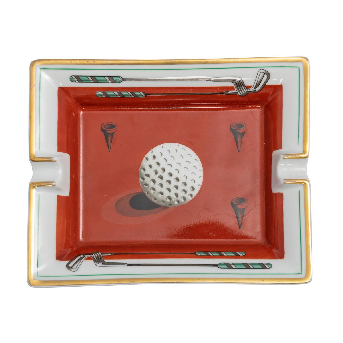 A ceramic ashtray by Hermès, made in France in the latter half of the 20th century. These ashtrays have always been very collectable with the vintage models in particular. This one has a lovely golf theme but at the same time typically Hermès; a