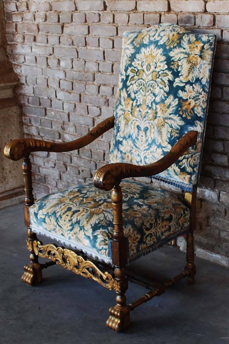 This sumptuously hand-carved beechwood chair has scrolling arms with acanthus leaves and flower motifs.
Block paw feet, united by an H frame stretcher. The beechwood frame is partly gold paint gilded. The upholstery is of recent age and is in good