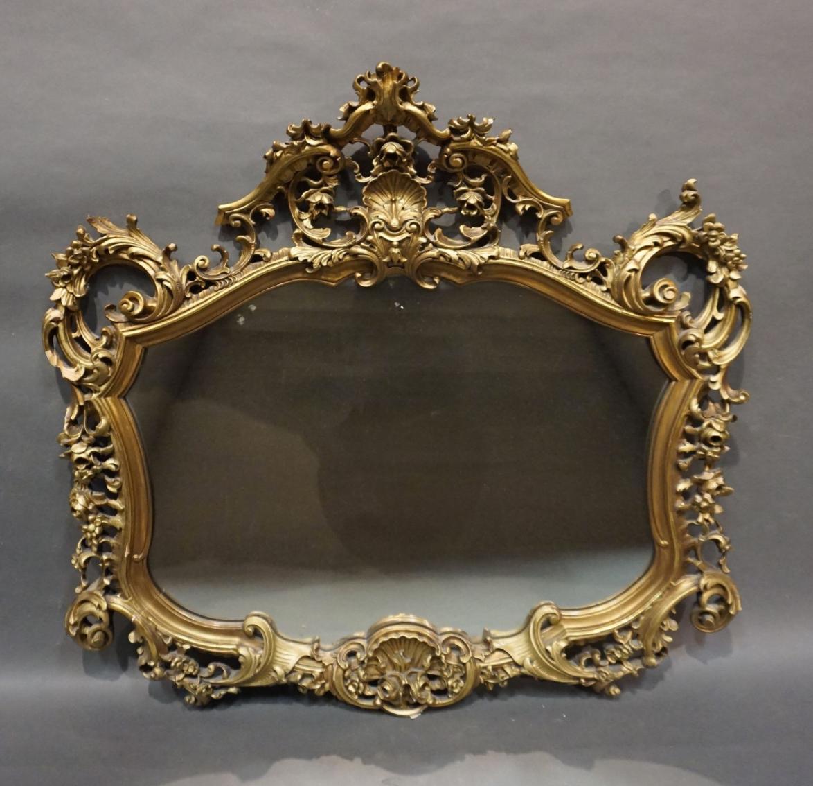Large wall mirror made in mid 20th century in France. Hand carved wooden frame with rich ornamentation in very good condition. Quite heavy piece that could become a lovely accent to any kind of interior.
France, circa 1950.