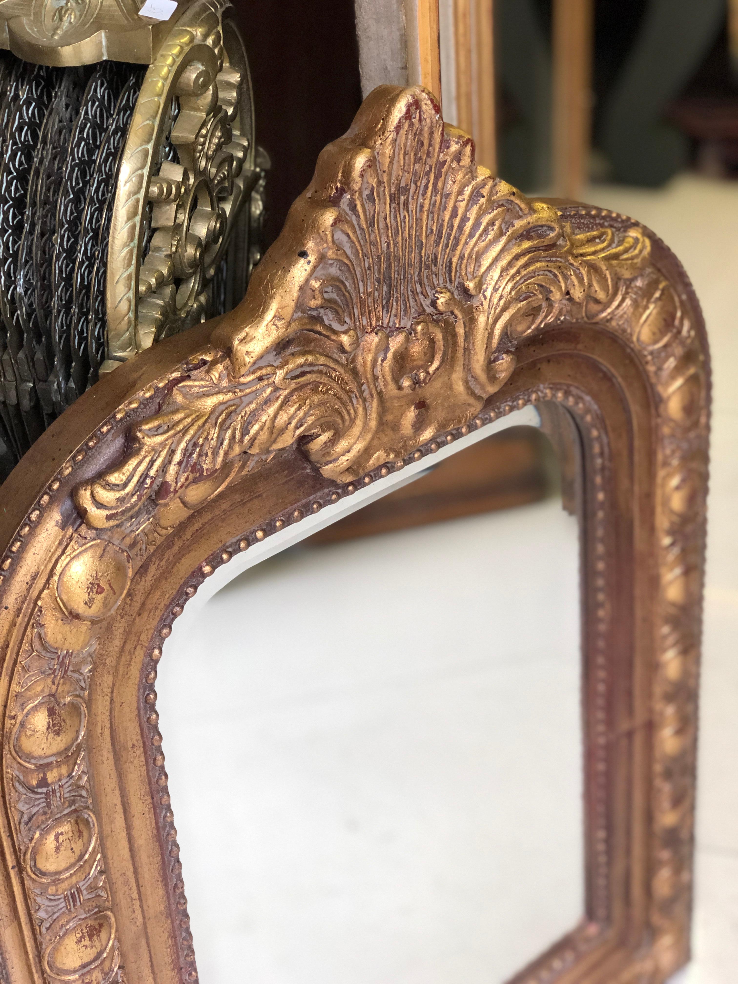Very massive and interesting model of a giltwood hand carved mirror with original crystal glass. Very good condition.
France, circa 1900.