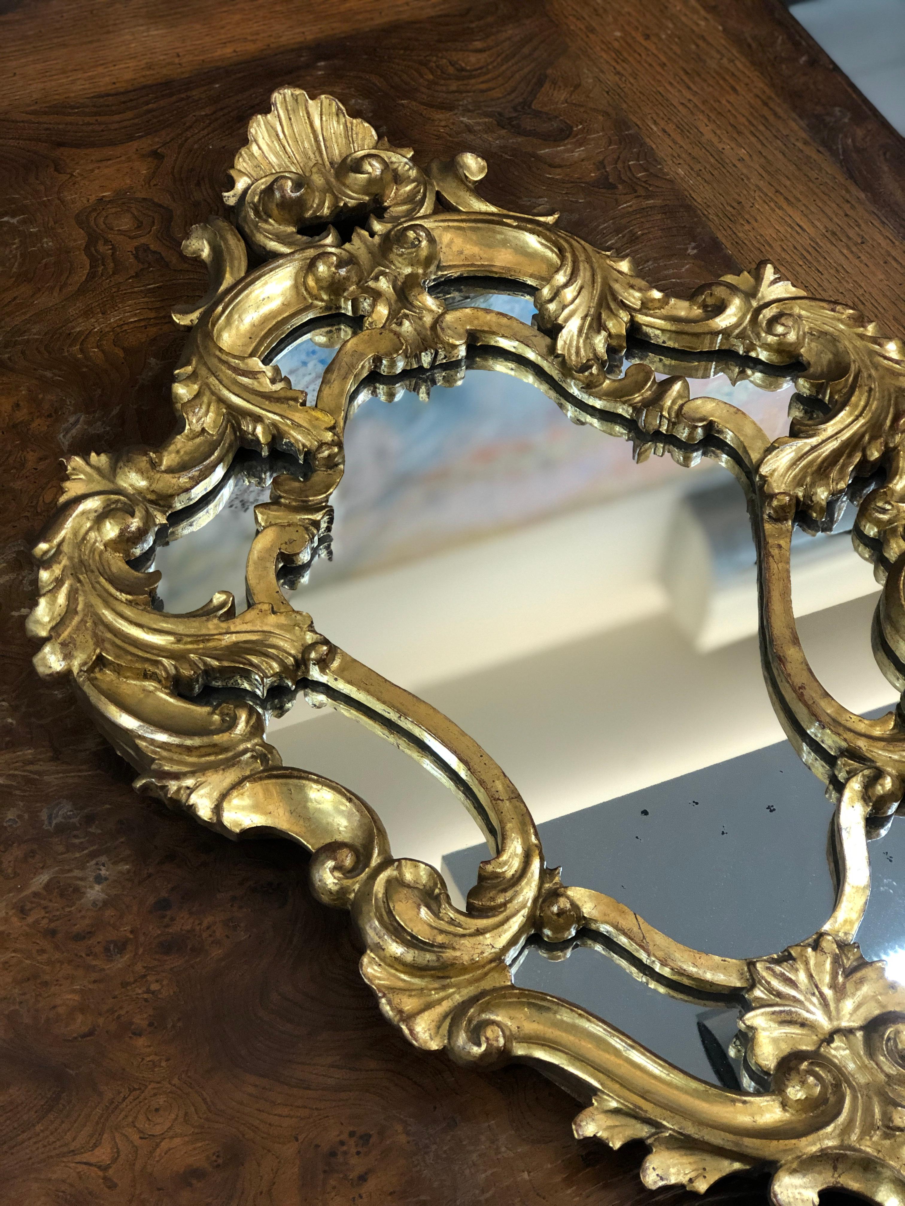 Beautiful giltwood hand carved mirror with its original crystal glass in very elegant curved shape and double frame.
Very good condition.
France, circa 1880.