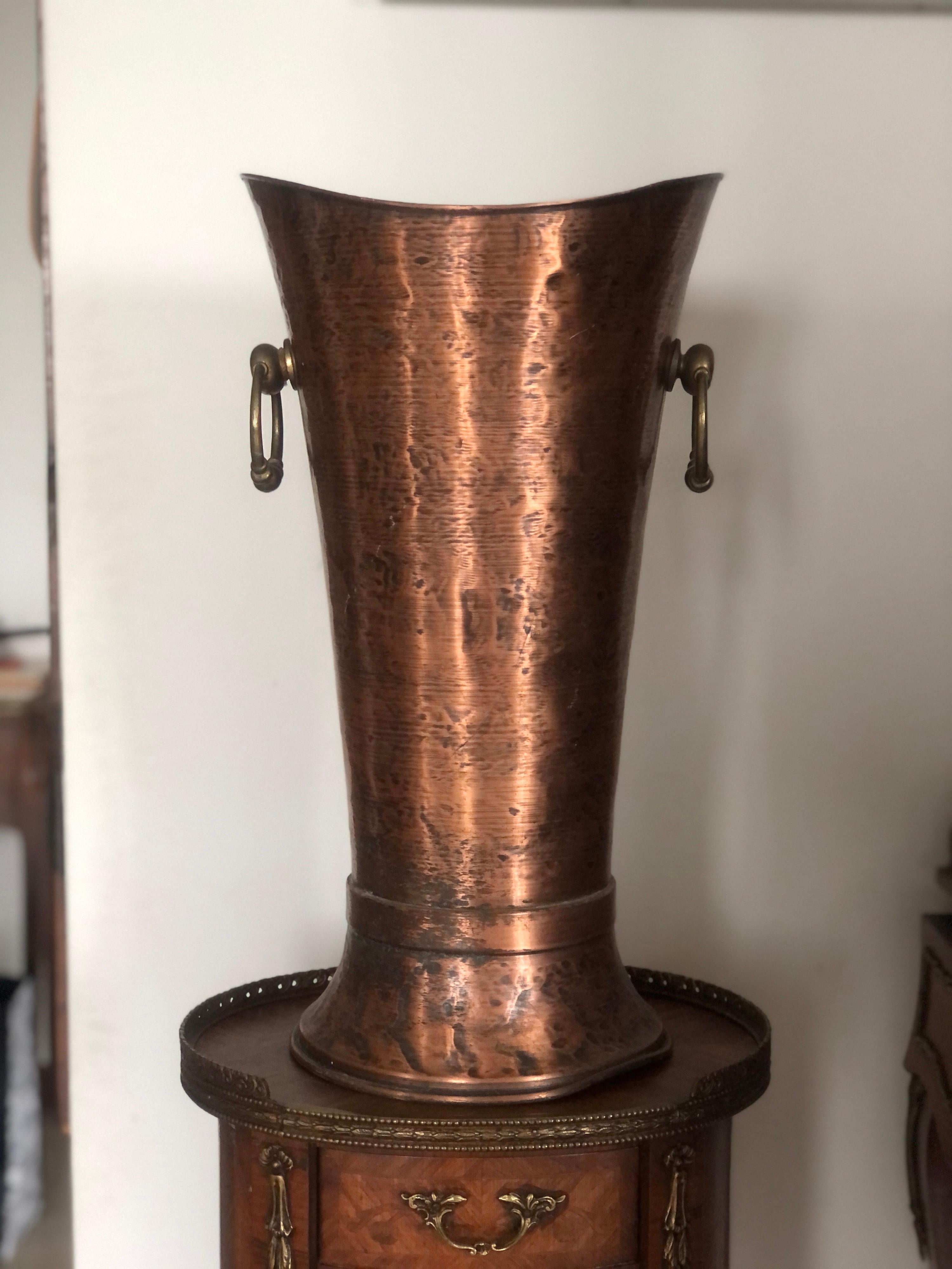 French hand-hammered solid copper umbrella holder with bronze holders,
France, circa 1920.
 