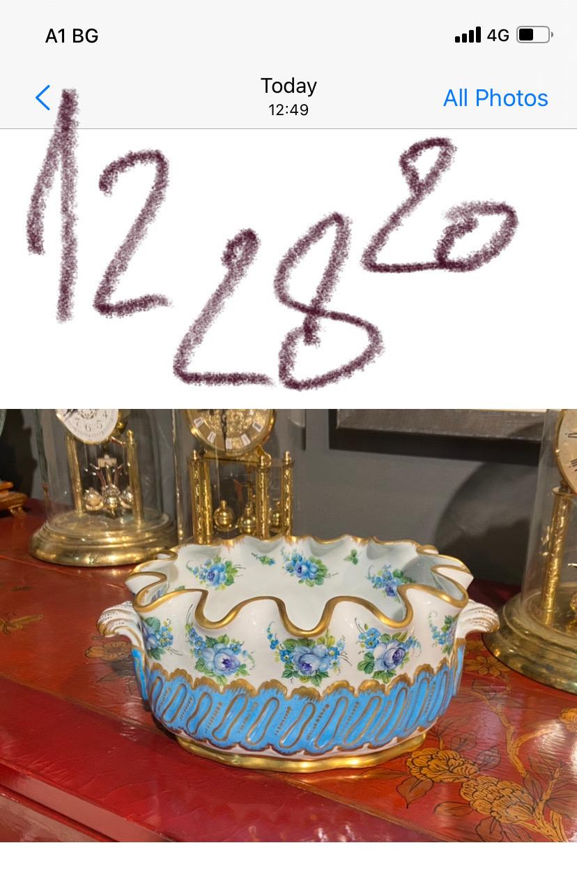 Great French hand painted with lovely floral decoration in blue and green surrounded with gold finish serving bowl or centre piece by Limoge.
France.