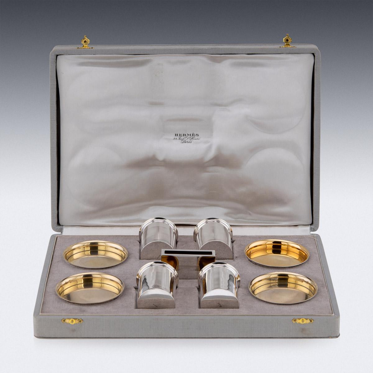 20th Century Art Deco Hermes 9 piece vermeil solid silver smoker's requisites, contained in the original large Hermes fitted grosgrain case, comprising four cigarette canisters, four ashtrays, a match holder. Hallmarked French silver (950 standard),