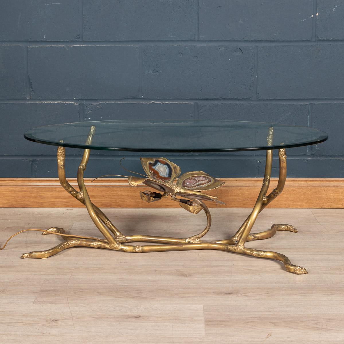 A stunning and striking sculptural coffee table or side table in the form of a butterfly with its wings outstretched. Hand made by the famous designer of the 1970s Henri Fernandez, this item is made largely from quality brass and agate slices, the