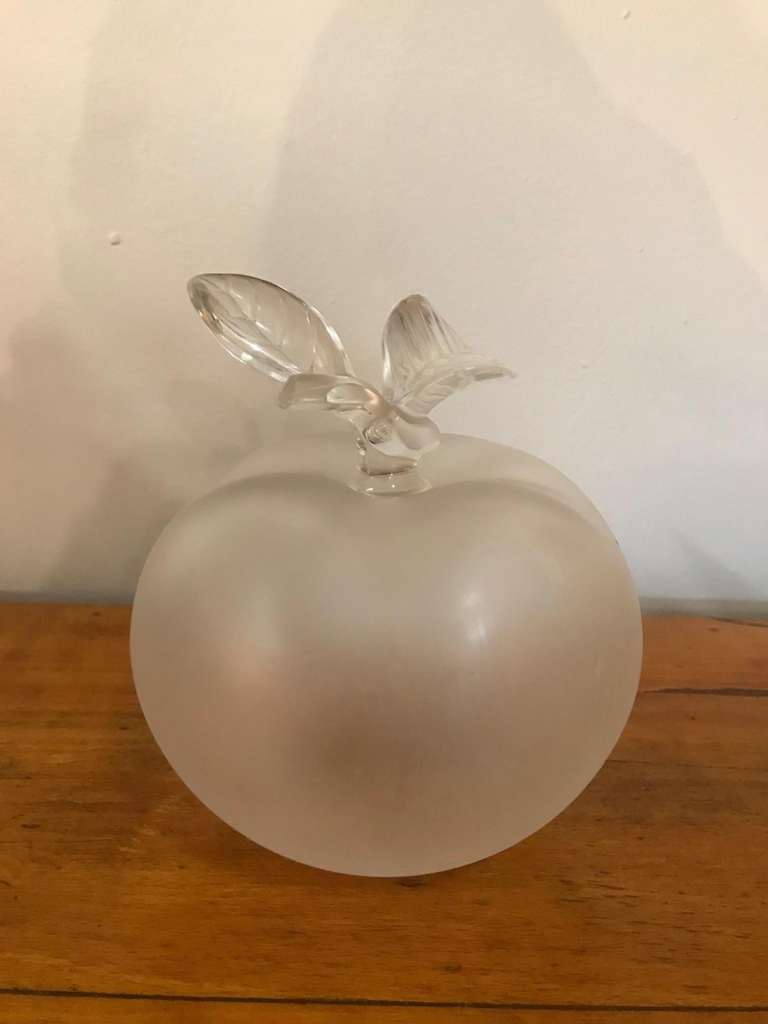 Beautiful 20th century French Lalique clear and frosted crystal Nina Ricci apple perfume bottle.
This wonderful perfume bottle has a frosted apple shaped body with clear leaf decorated stopper. The bottle is marked with etched 