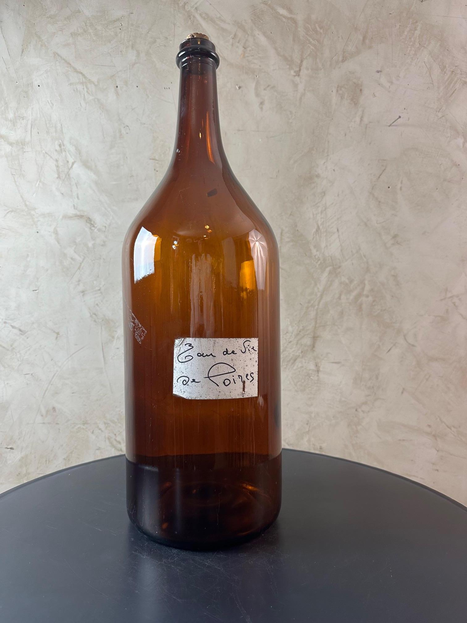 Gran botella francesa de vidrio ámbar del siglo XX Francés en venta