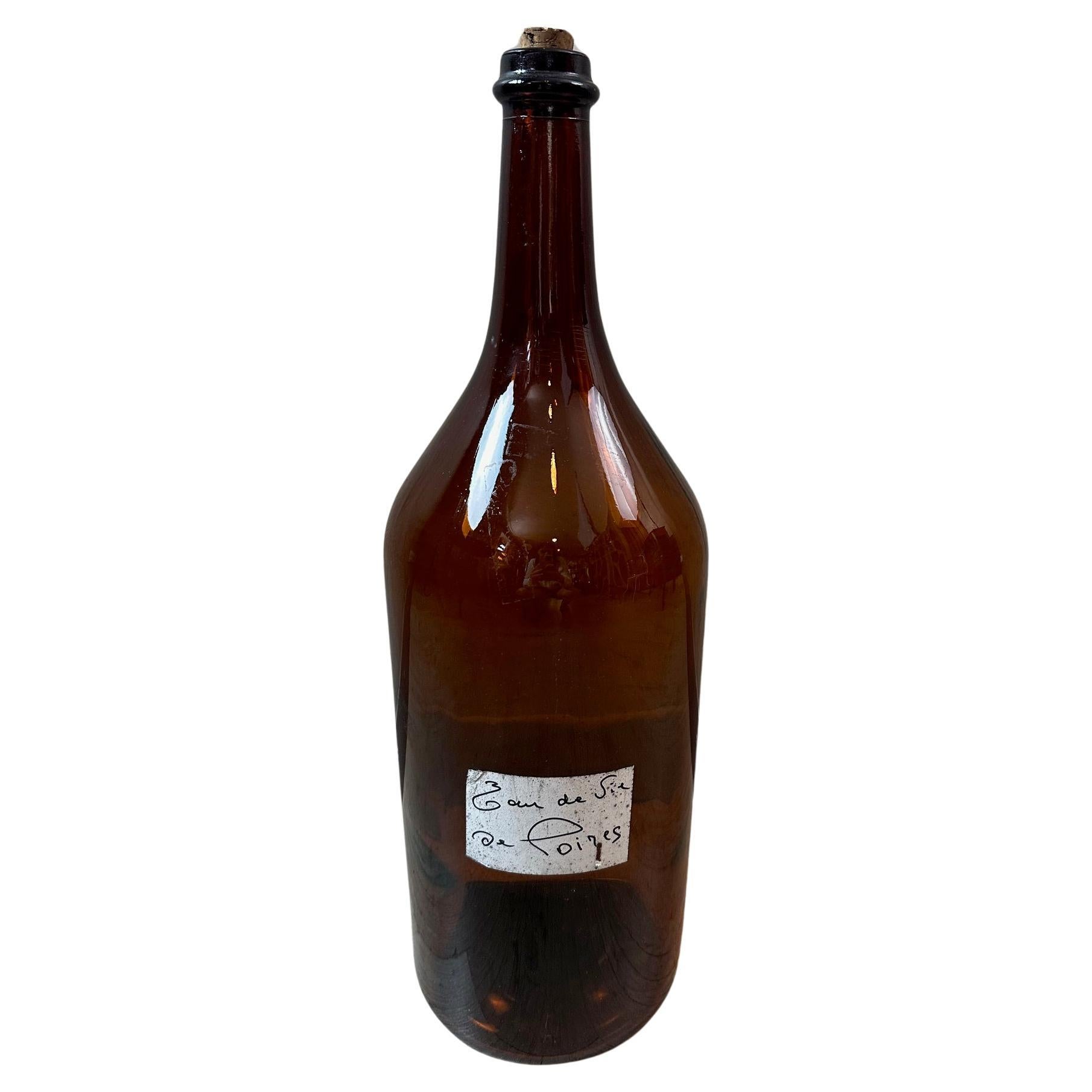 20th century French Large Amber Glass Bottle