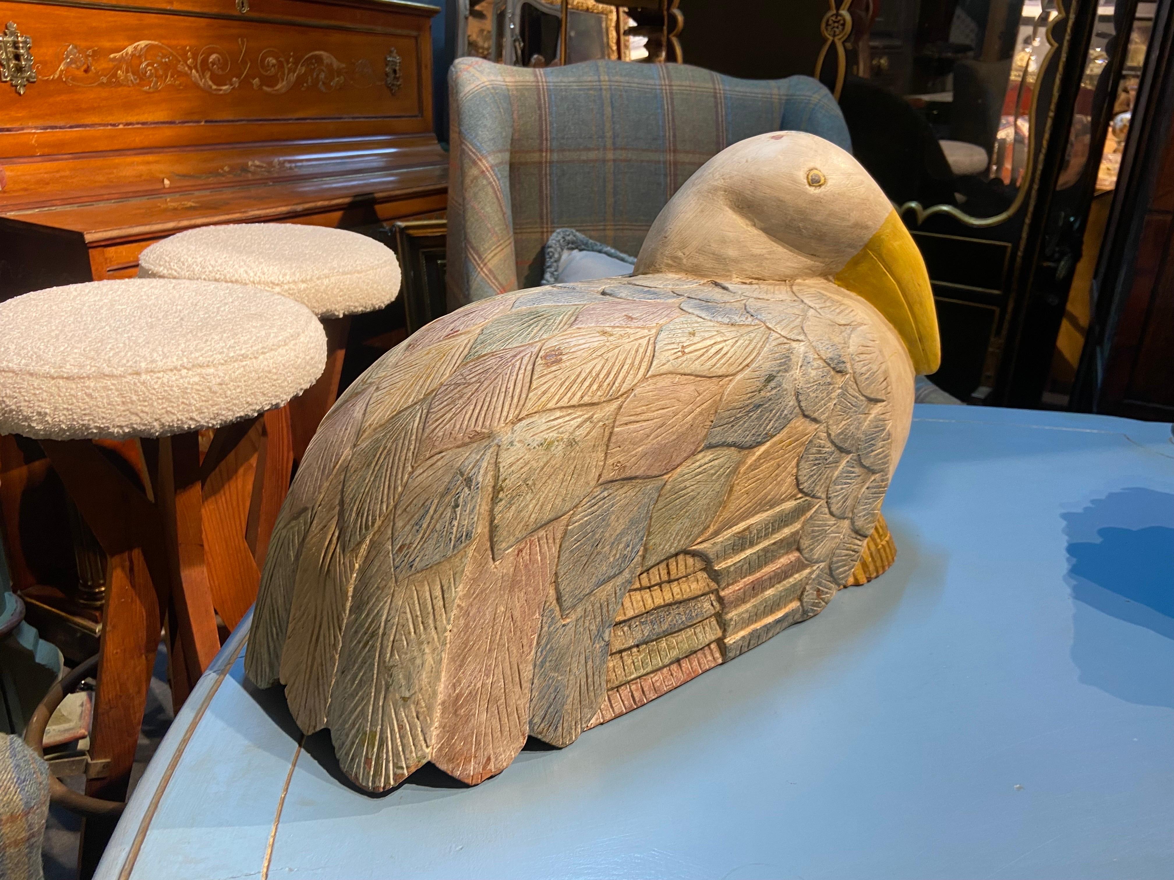 Two large decorative hand carved and hand painted colourful birds made in early 20th century in France. Both are quite heavy and are in good condition with no restoration and no missing parts, only one has a crack at the front which is visible at