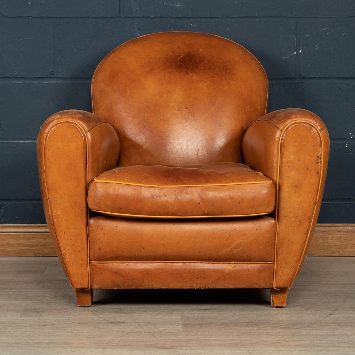 A fine quality leather armchair made in France in the latter end of the last century. Hand made, the timber frame is clad with a wonderfully rich tan leather hide, supple to the touch and extremely comfortable. Even though the armchair shows some