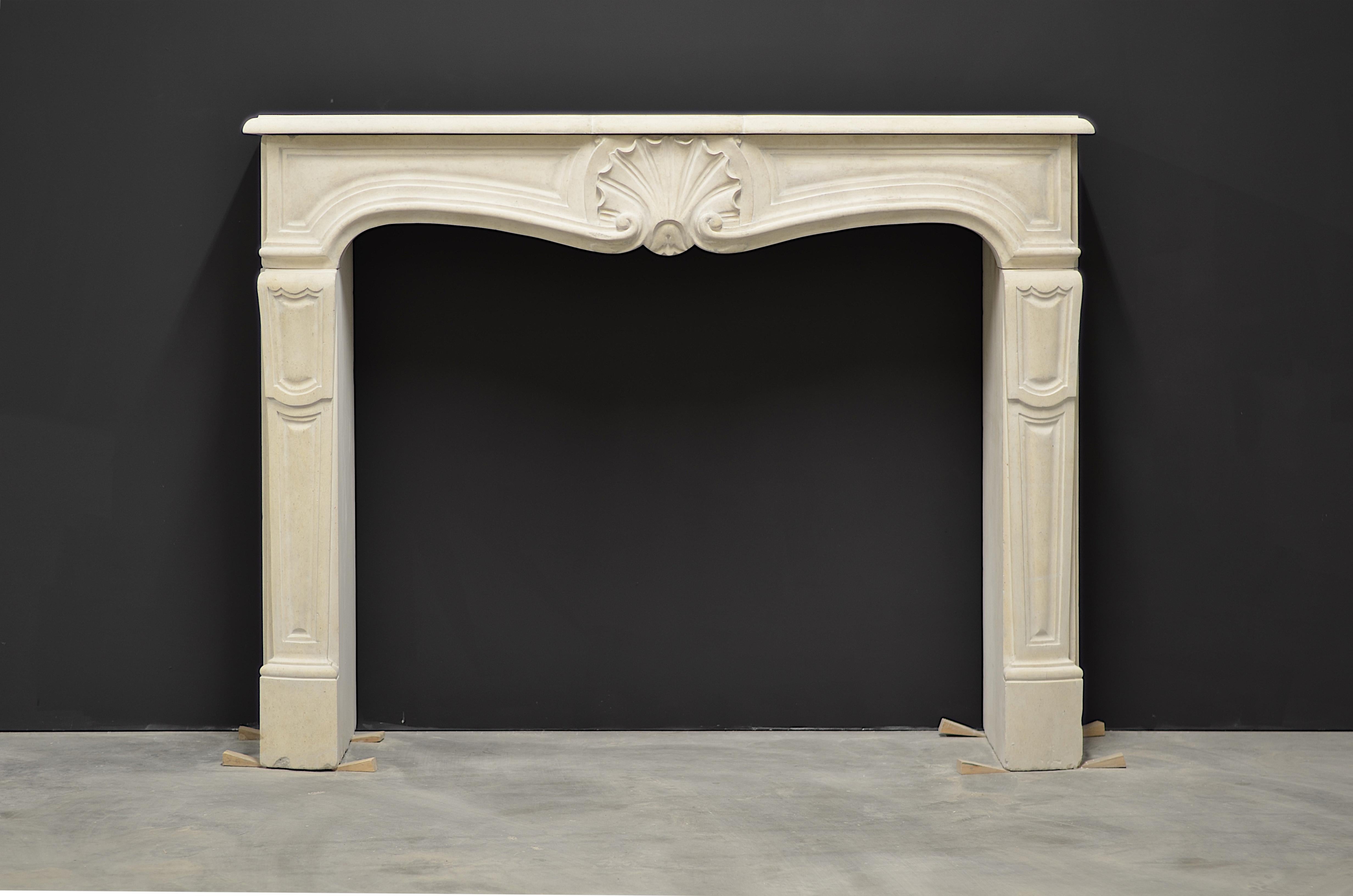 Nice and clean French Louis XV fireplace mantel from the 20th century.
The lovely shell decorated frieze rests on solid jambs and supports a nice shaped and profiled top shelf.

Some minor repairs have been made.

The opening dimensions are:
Width: