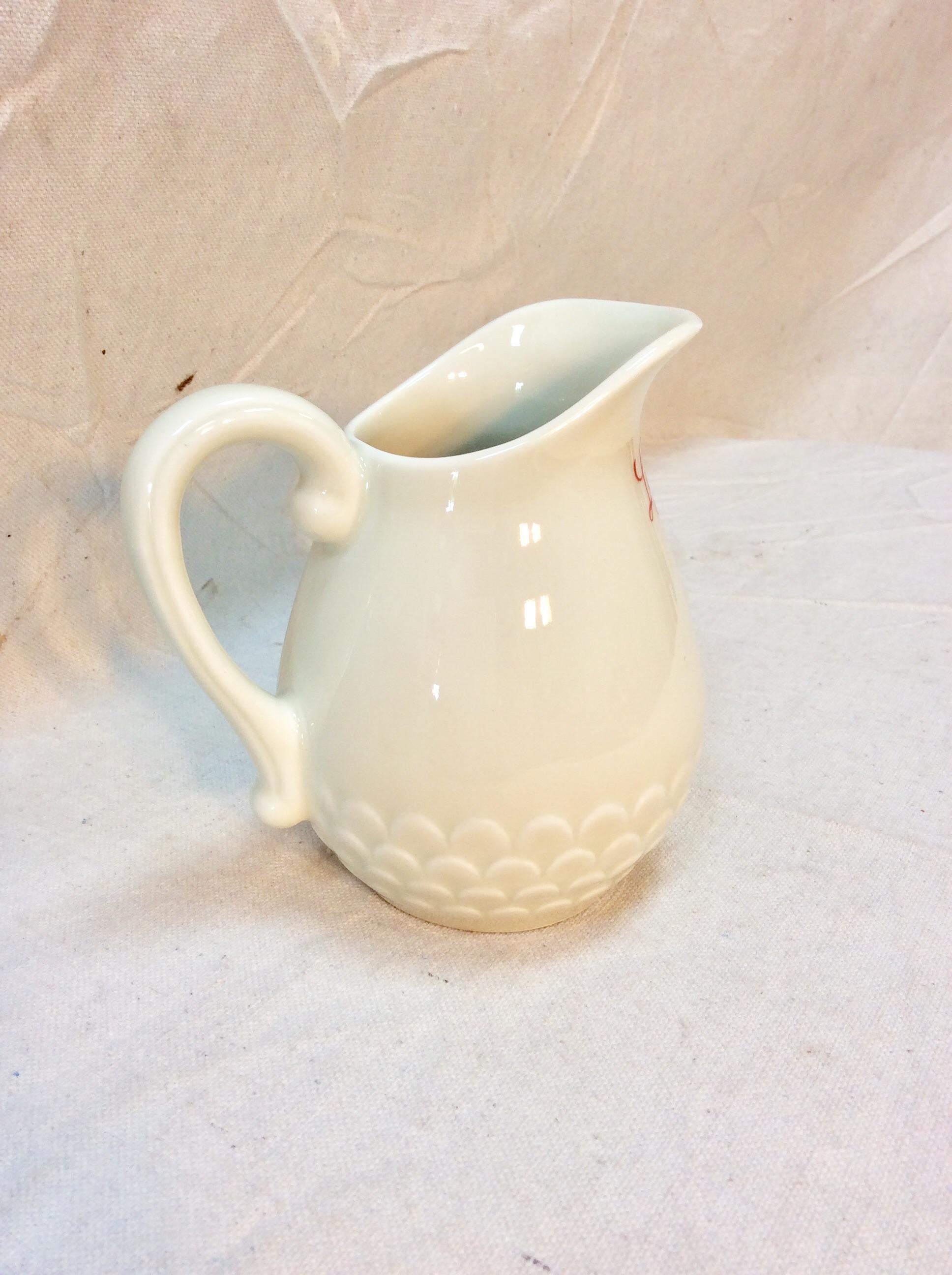 Found in the South of France, this 20th Century French Limoges Restaurantware Pitcher is hallmarked on the upper side Le Jourdan which was most likely the name of the French restaurant that it was used. The underside of the pitcher is hallmarked