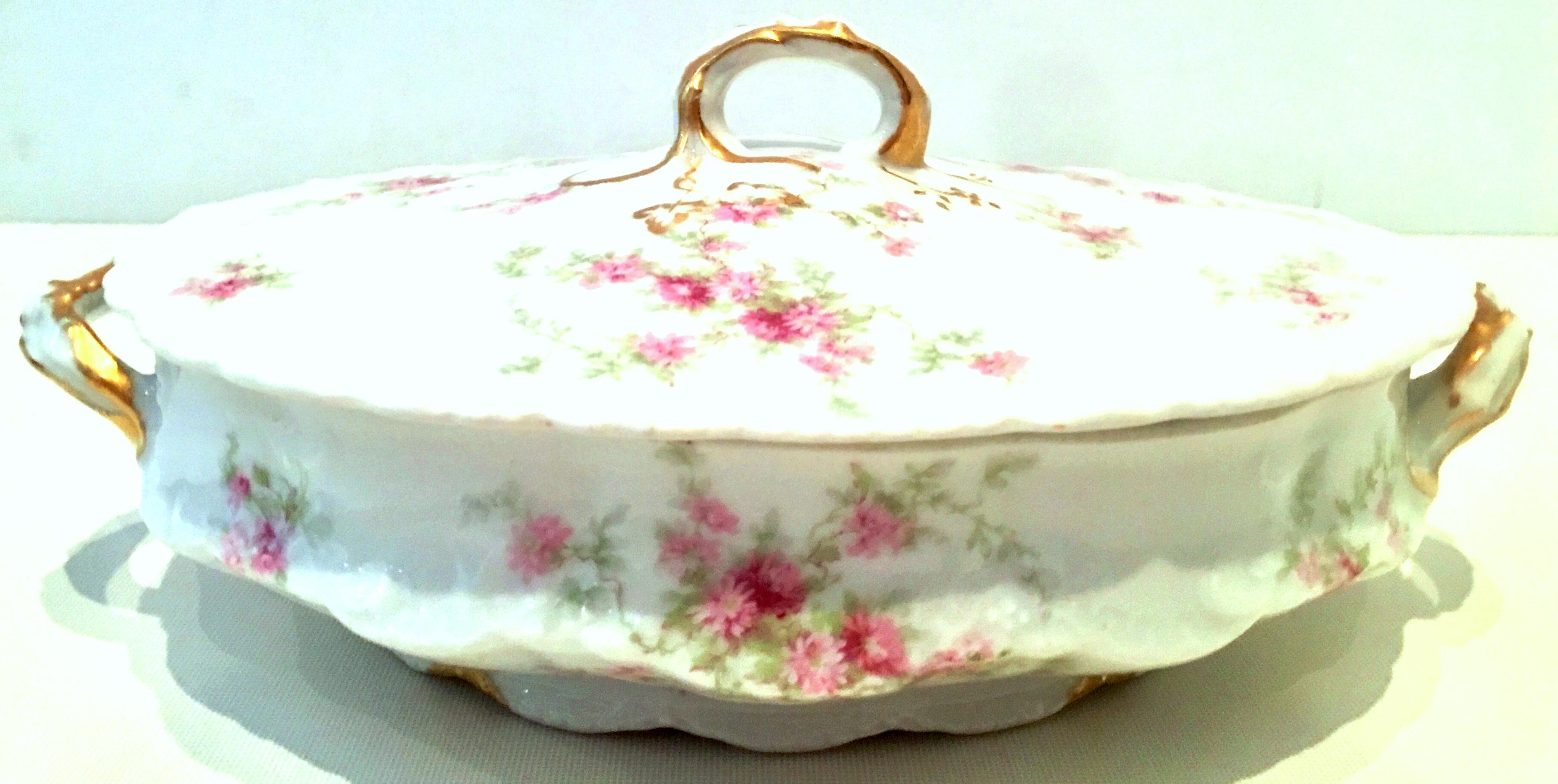 20th century French limoges porcelain and 22-karat gold set of three serving pieces by, Theodore Haviland. Set features a bright white ground with scalloped shape detail, hand painted in a bright pink and green flowing rose rose with hand painted