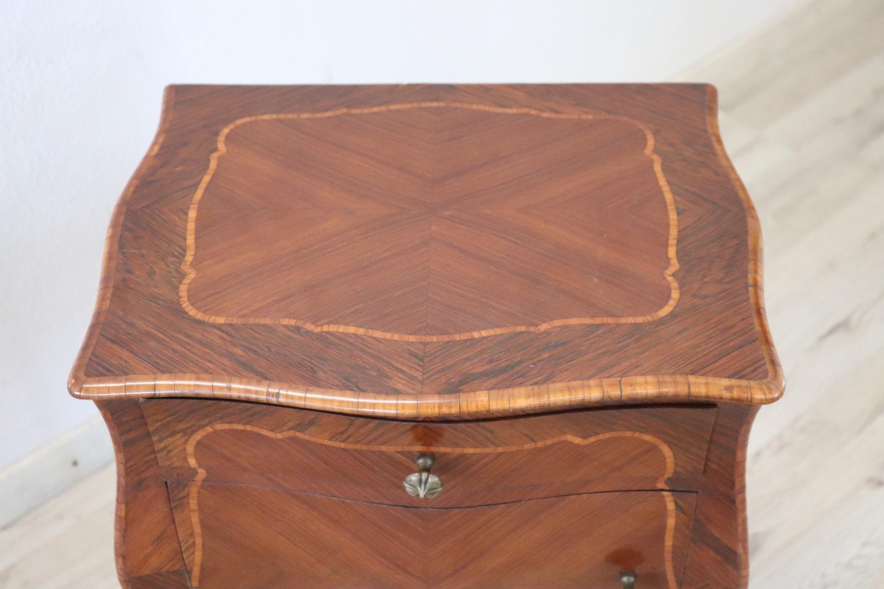 Rare and fine quality French Louis XV style 1970s side table or nightstand in inlaid wood with the particular bean shape, the legs are long and slender. The decoration is on each side. Made with precious woods rosewood. On the front one comfortable