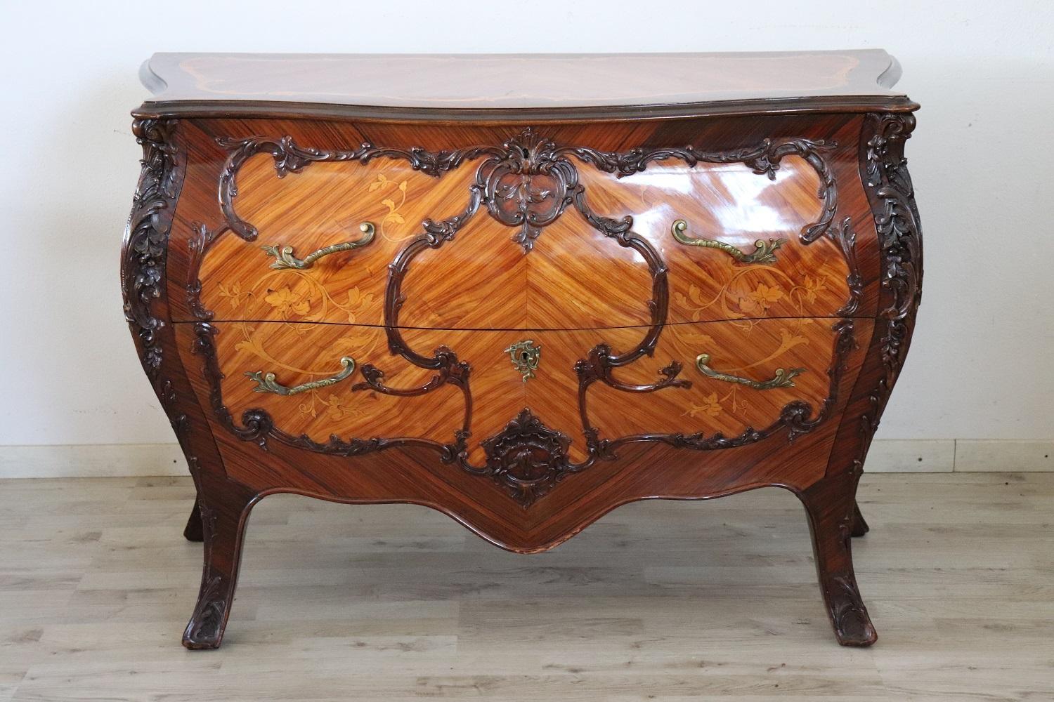 Louis XV style furniture, 1930s. The fine rosewood inlaid wood. Refined and rich inlay work of floral taste on each side of the piece of furniture. Particular rounded shape. On the front there are two comfortable large drawers. You will receive in