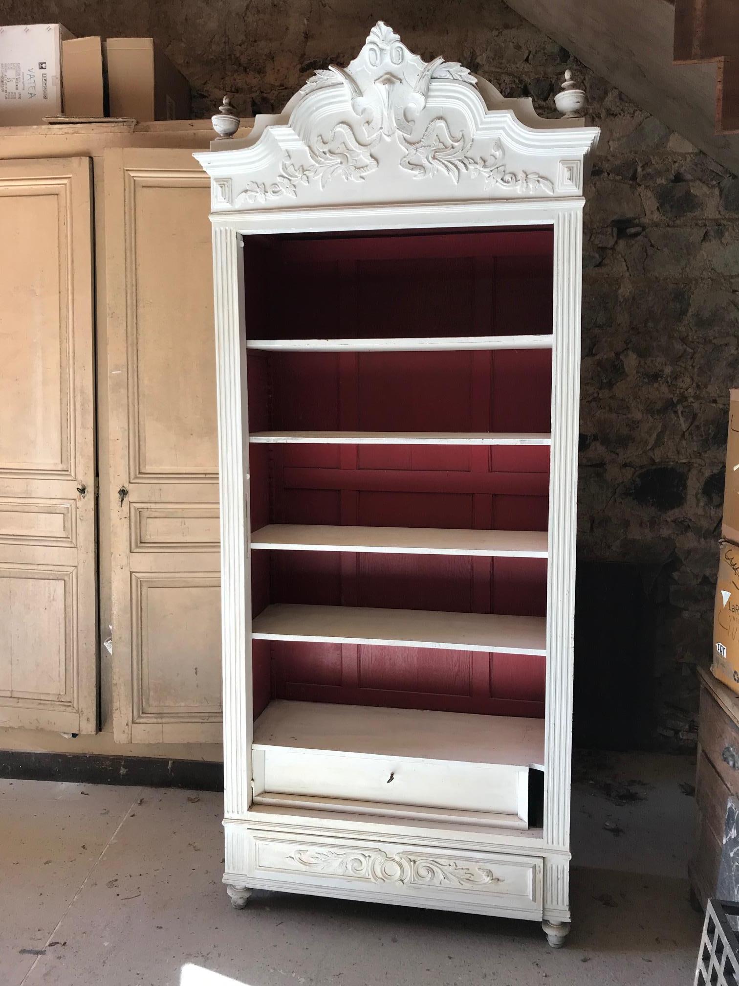 Beautiful 20th century French Louis XV style painted Armoire, wardrobe. 
Painted in white on the outside and red on the inside. 
Two drawers on the bottom of the armoire. Removable cornice. 
Many shelves. There is no door.
  