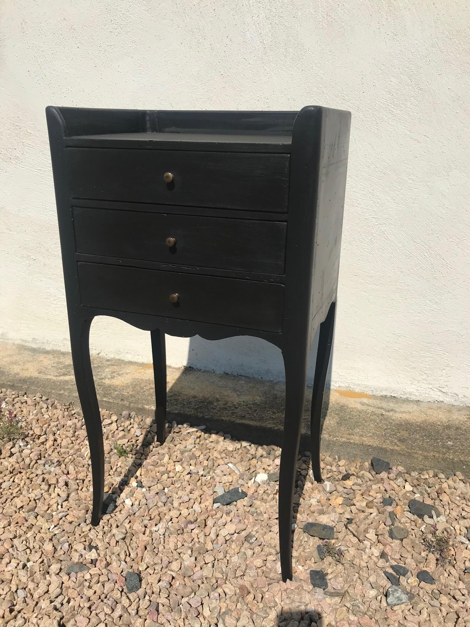 Very nice 20th century French Louis XV style black painted bedside from the 1920s. 
Three drawers with gilded brass handles. 
Good quality and condition.