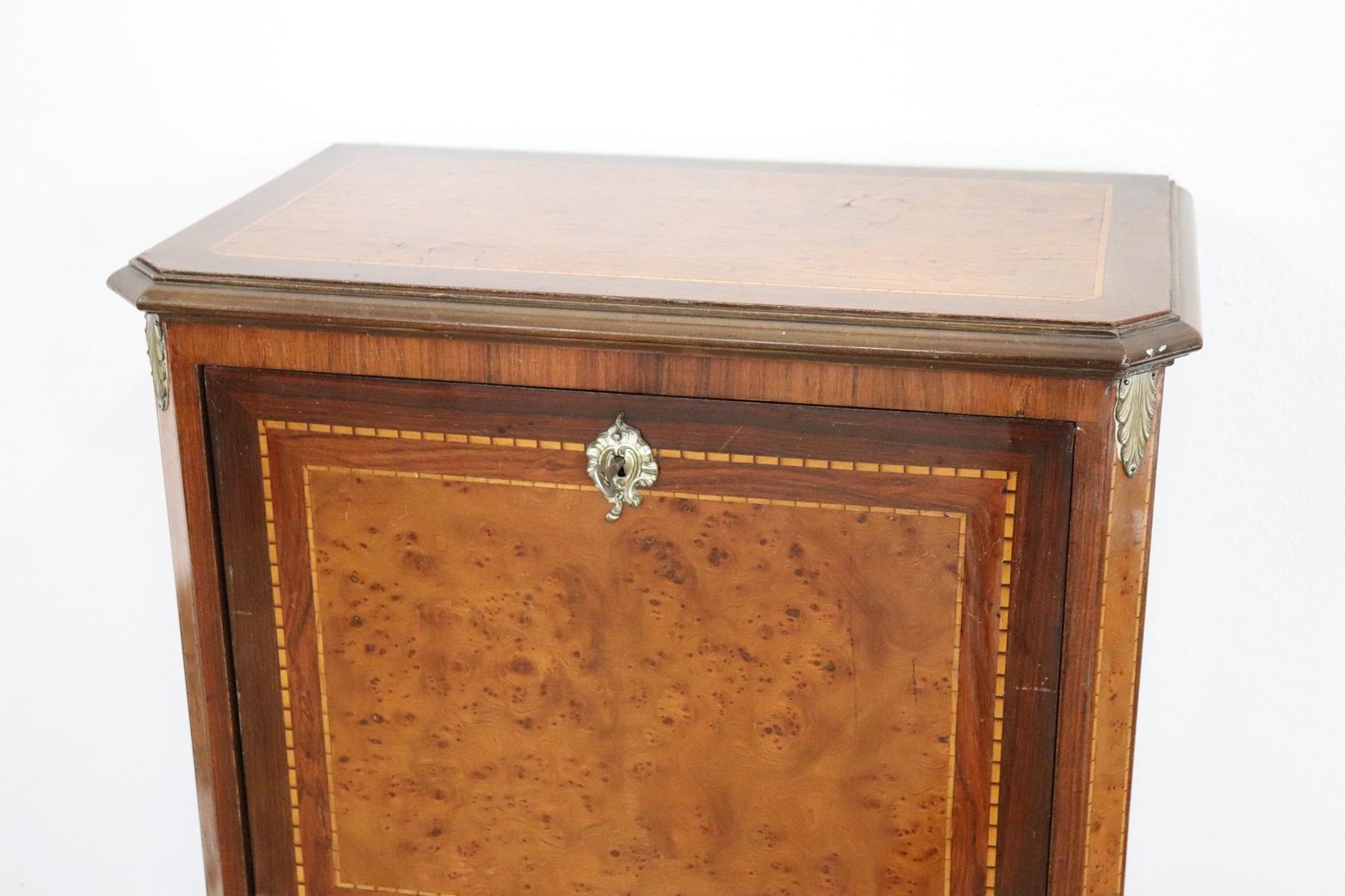 Louis XV style furniture richly adorned with gilded and chiselled bronze. The fine bois de rose wood with inlay. On the front and on the sides precious birch wood briar. Mobile very elegant but also practical for use with three comfortable drawers.