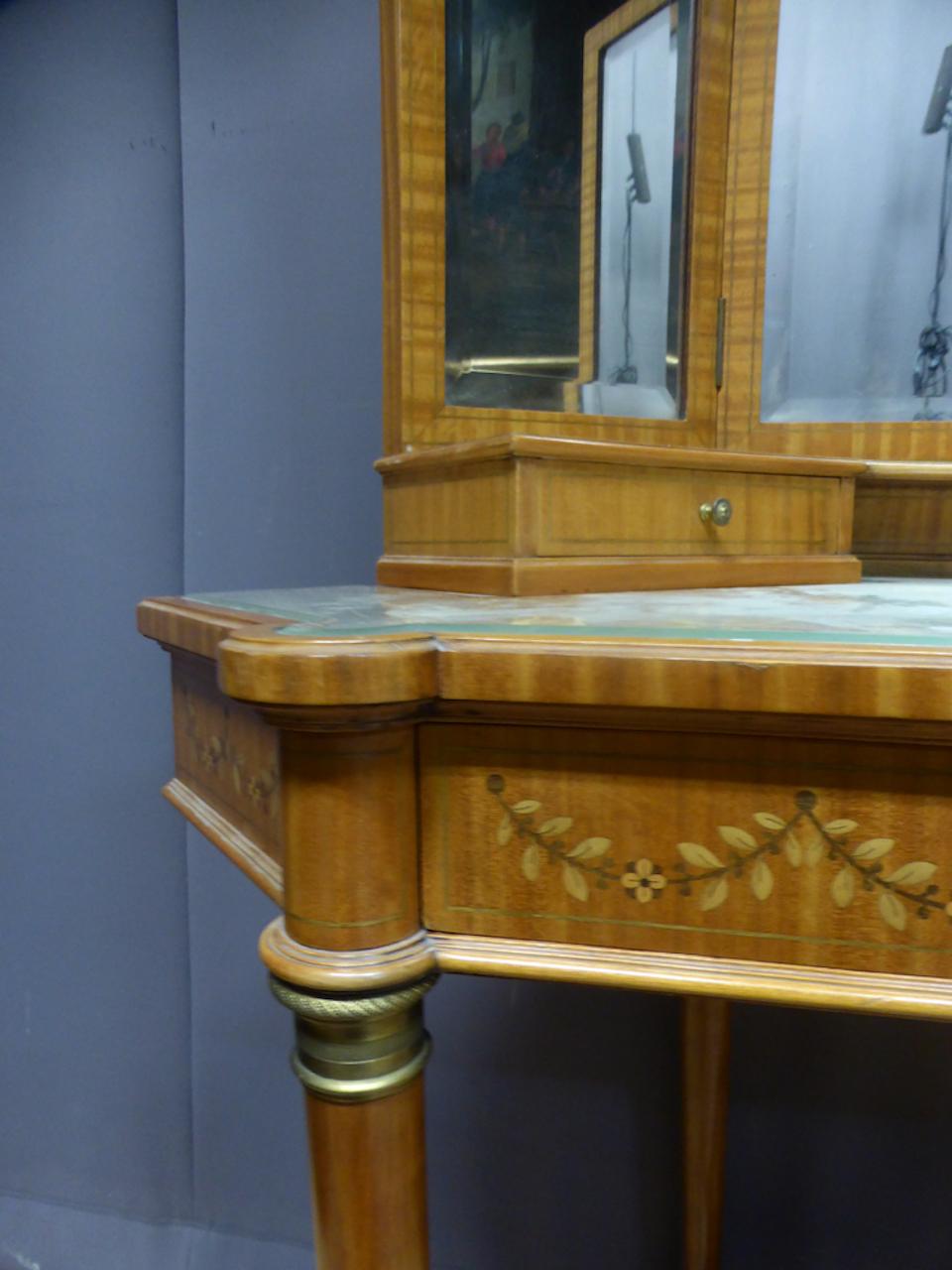20th century very charming natural wood dressing table and decorations of Louis XVI style. This furniture is very practical because it can be placed in a corner of room or on a wall.
The mirrors are beveled. 
The bases of feet are furnished with
