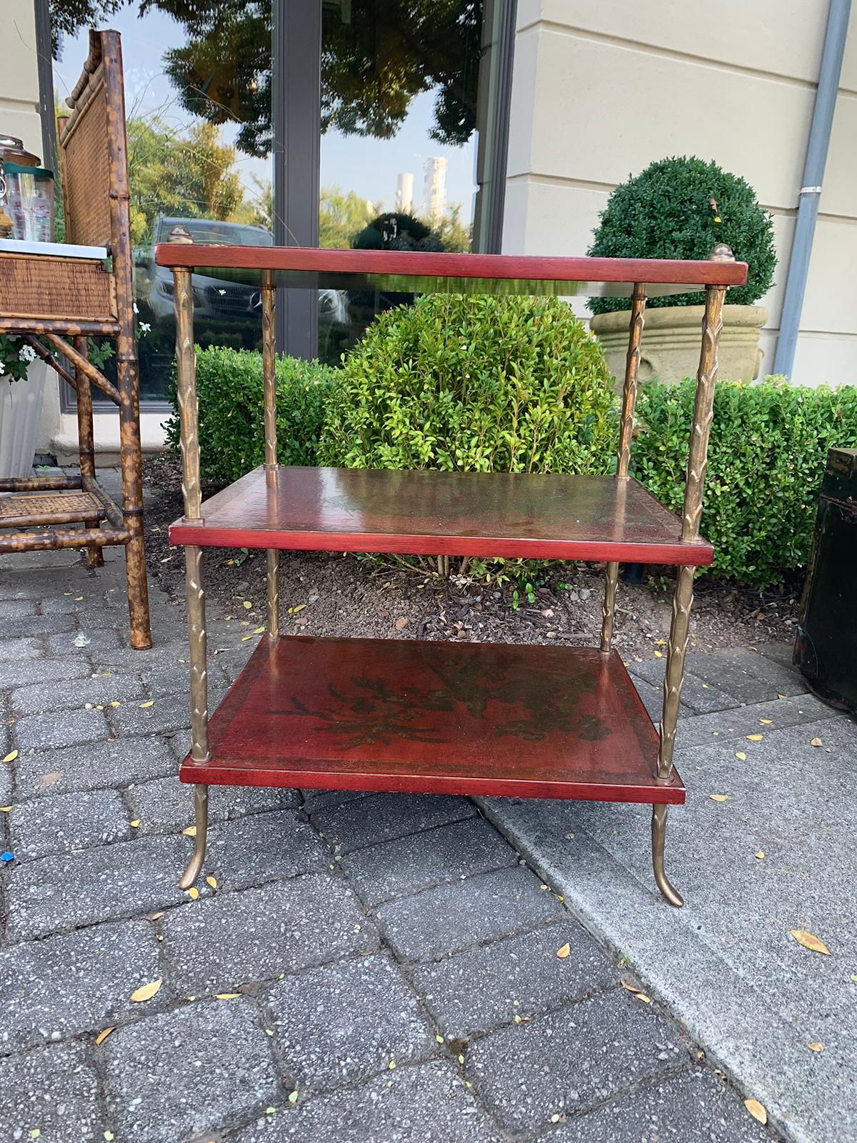 20th century French Maison Jansen style bronze and red chinoiserie three-tier étagère/ side table
legs are bronze palm tree motif.