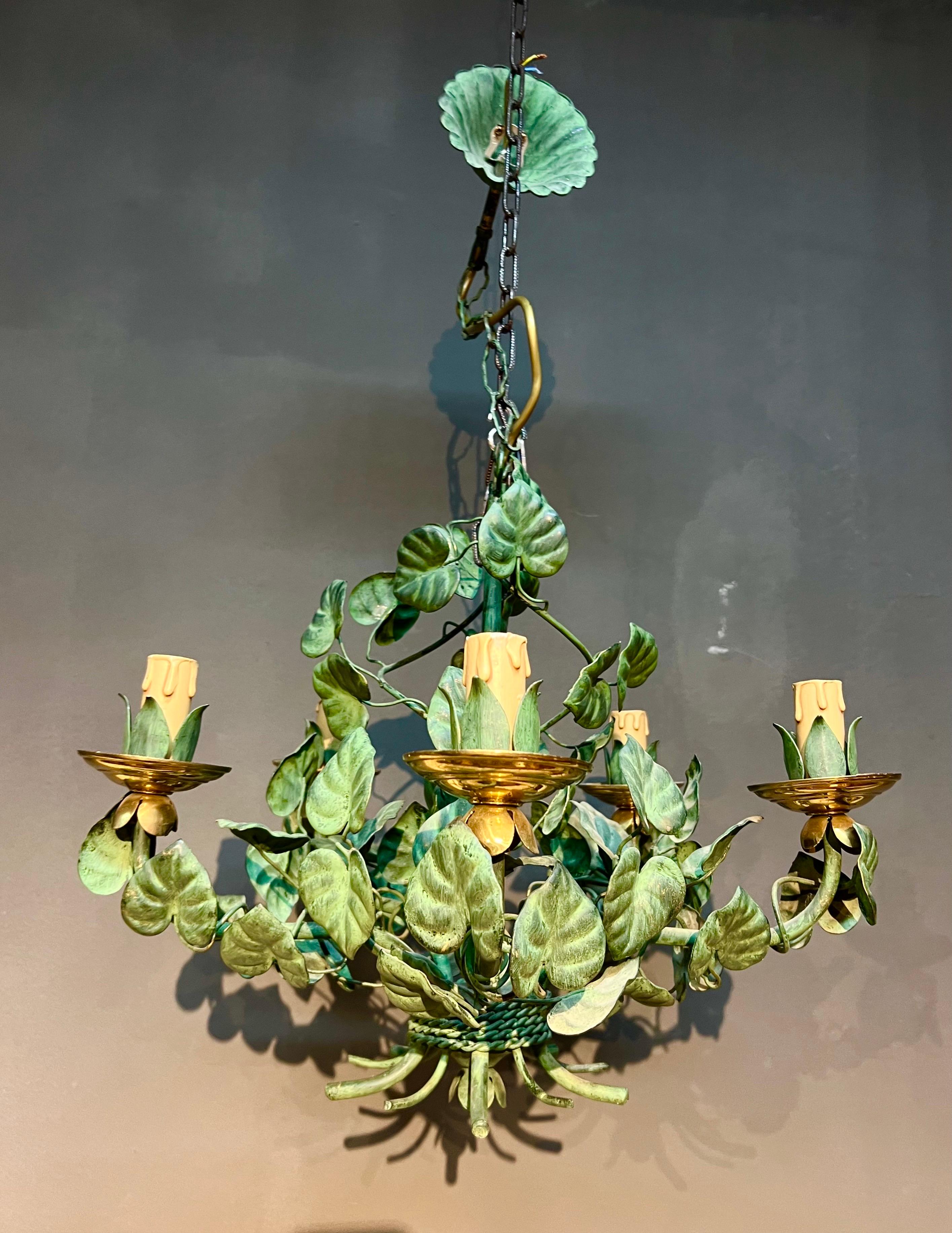 French handmade chandelier with five metal arms lovely decorated with green metal leaves made very realistic. Good overall condition.
France, circa 1960