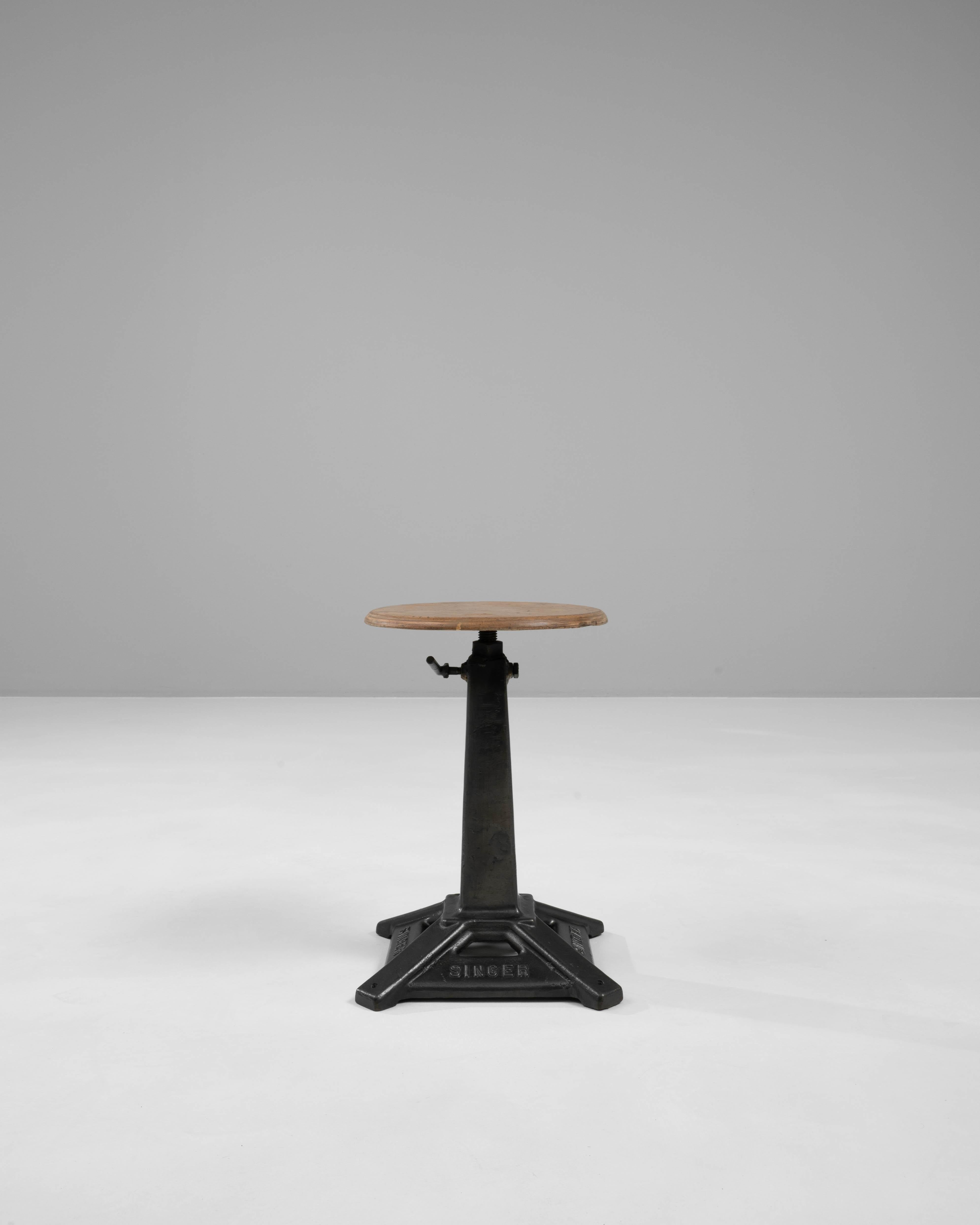 Introduce a touch of industrial chic to your space with this 20th Century French Metal & Wooden Seat. This unique piece combines robust metal and rustic wood, creating a striking contrast that captures the essence of industrial design. The sturdy