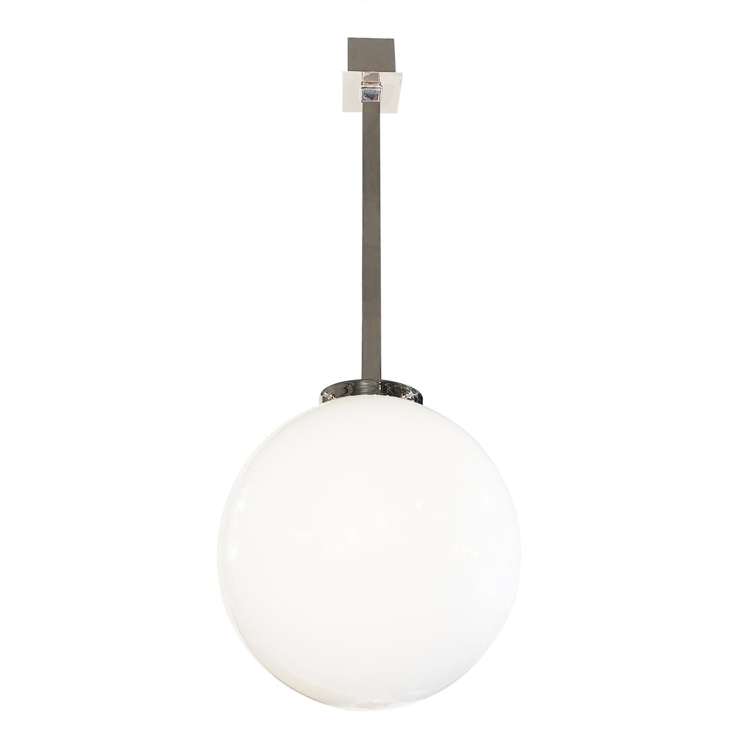 A French executed ceiling light fixture with a white milk colored glass bulb and a square rod in nickel. The vintage Art Deco pendant is in good condition, featuring a one light socket. The wires have been renewed. Wear consistent with age and use.
