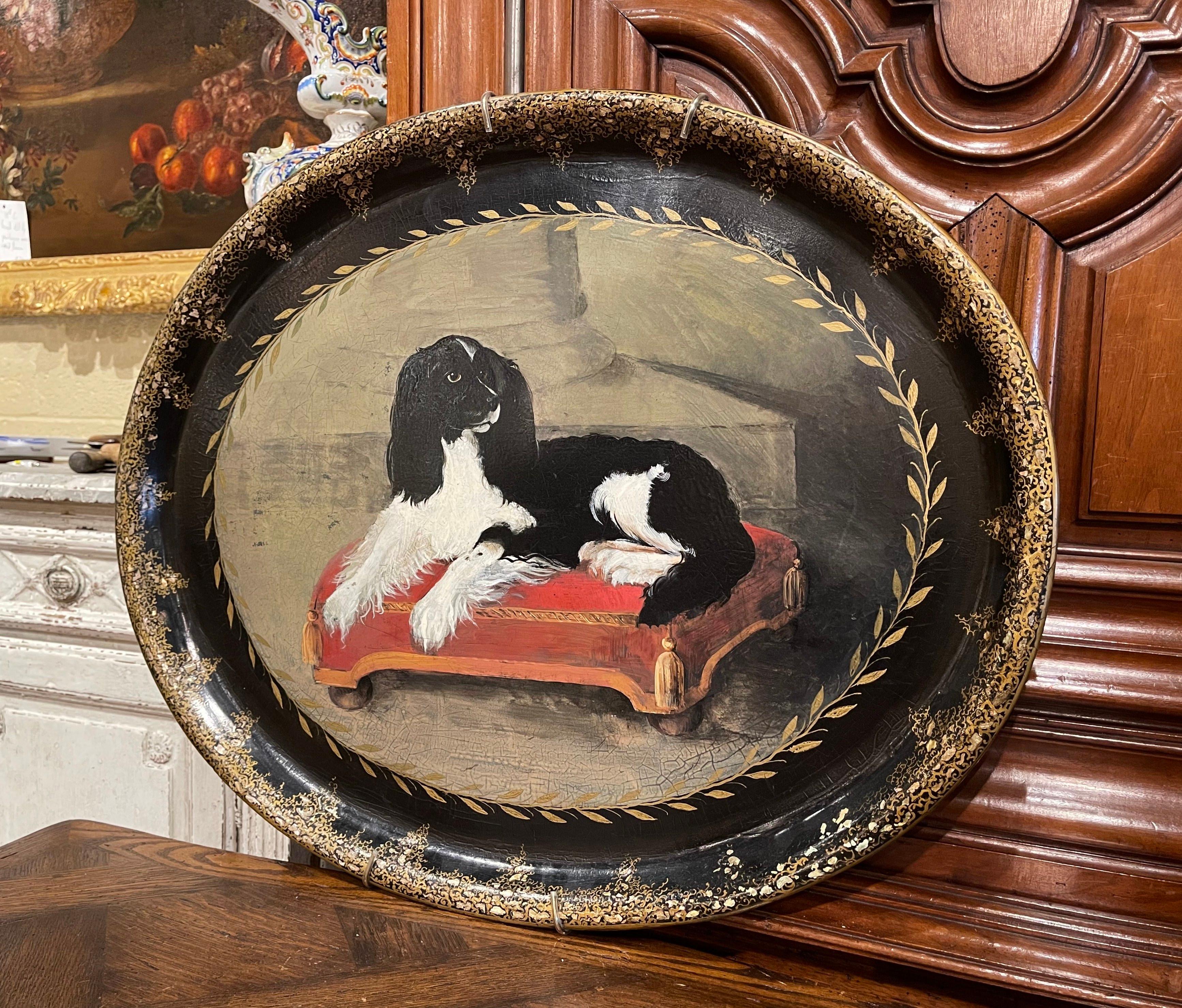 Embellish a wall with this decorative and colorful tray. Made of paper mache, the oval tray features a hand painted King Charles canine resting on a Royal pillow stool. The large wall table tray is in excellent condition with rich painted colors