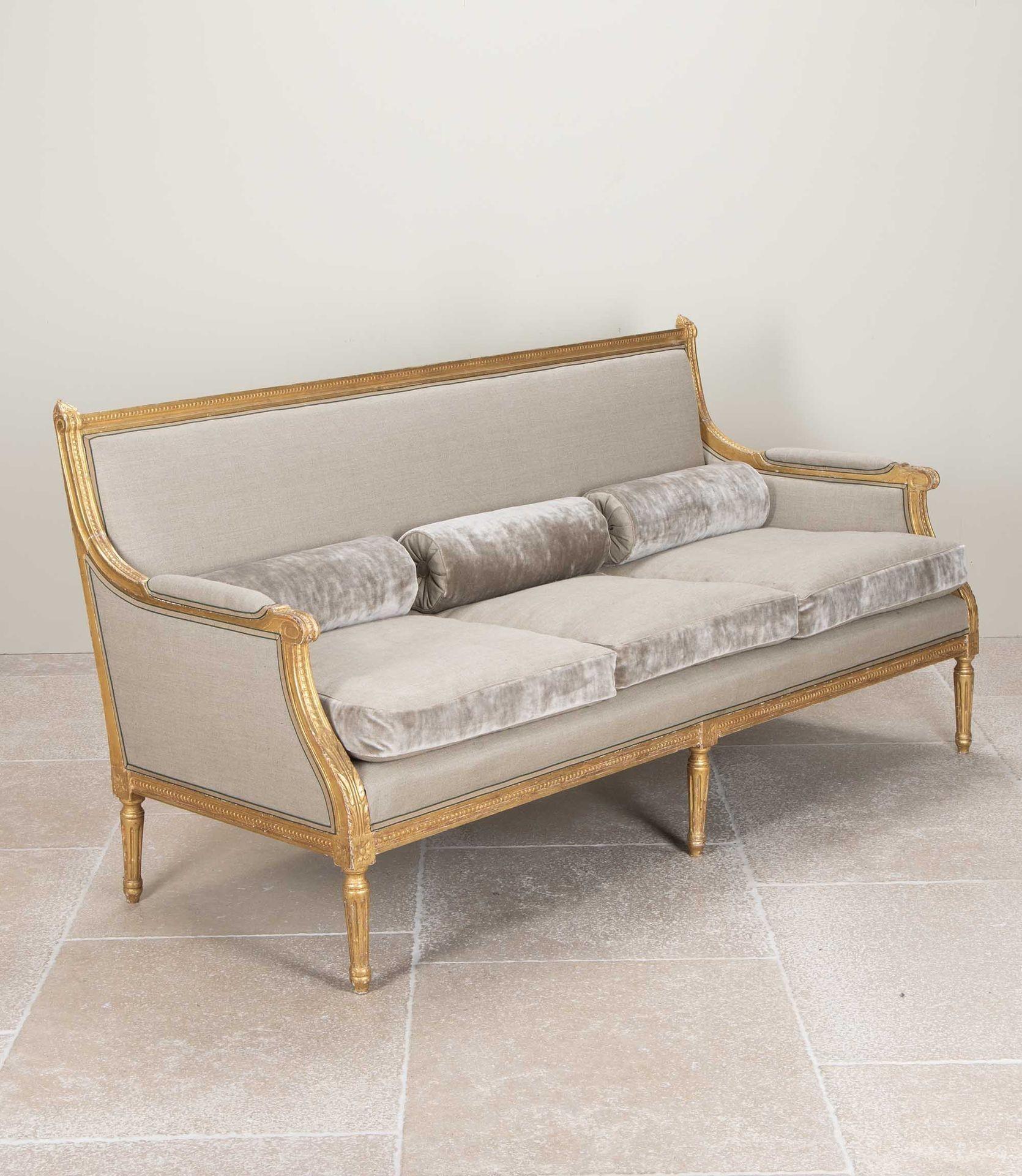 A beautiful carved giltwood Neo-Classical style sofa by Maison Jansen. 
Reference; Jansen Furniture by James Archer Abbot, Page 83 for a similar marquise.
France, Circa 1950.
Matching pair of armchairs also available.