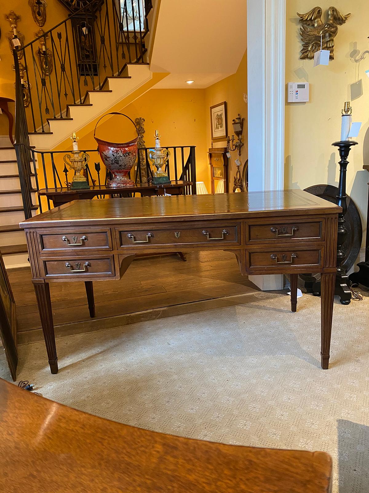 Probably 20th century French neoclassical wood, green embossed leather top desk, brass trim, shield escutcheons
Apron:21.5