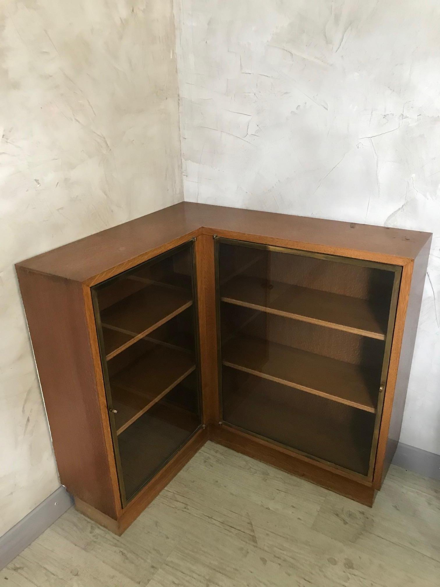 Very nice and rare 20th century French oak and gilted brass vitrine from the 1940s.
Two opening doors with gilted brass sides, and two keys also.
Many shelves on the inside.
Good quality and original.