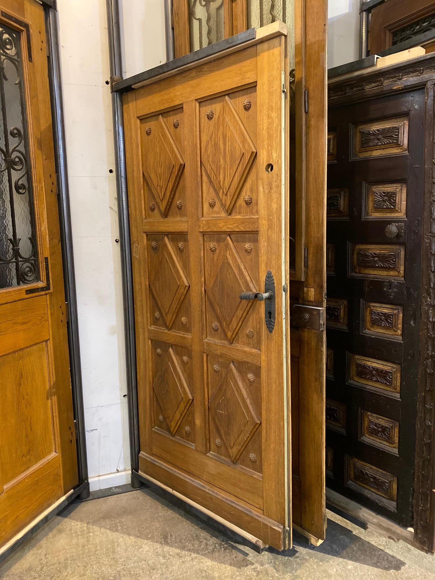 This antique door originates from France circa 1900s and features diamond carved panels with rosettes carved in the oak.

Measurements: 81.5” H x 39” W.