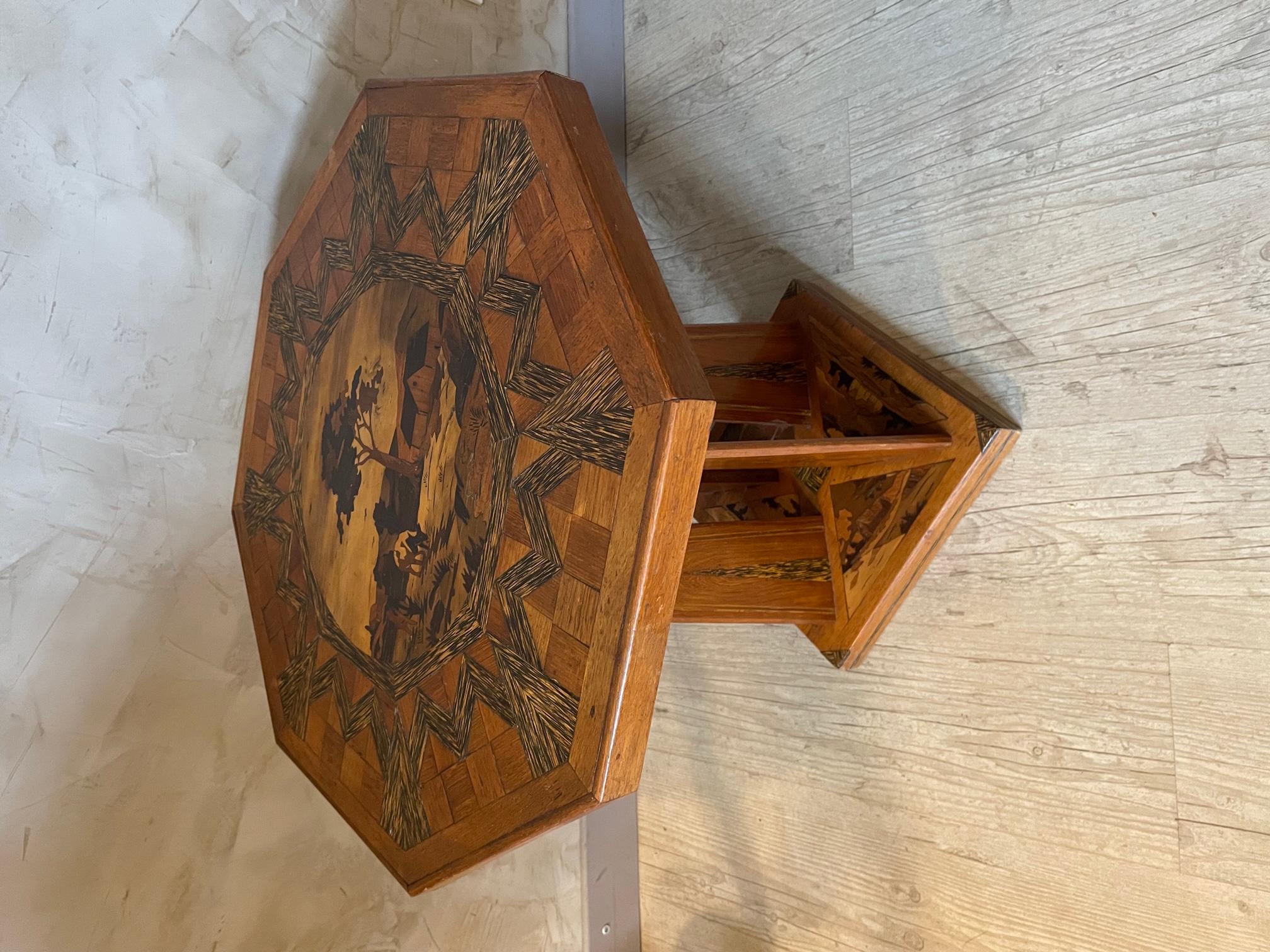 Beautiful and rare side table or gueridon made in the 1920s in oak marquetry. 
There is marquetry on the top and also on the base representing landscapes. 
Very nice quality. Rare piece.