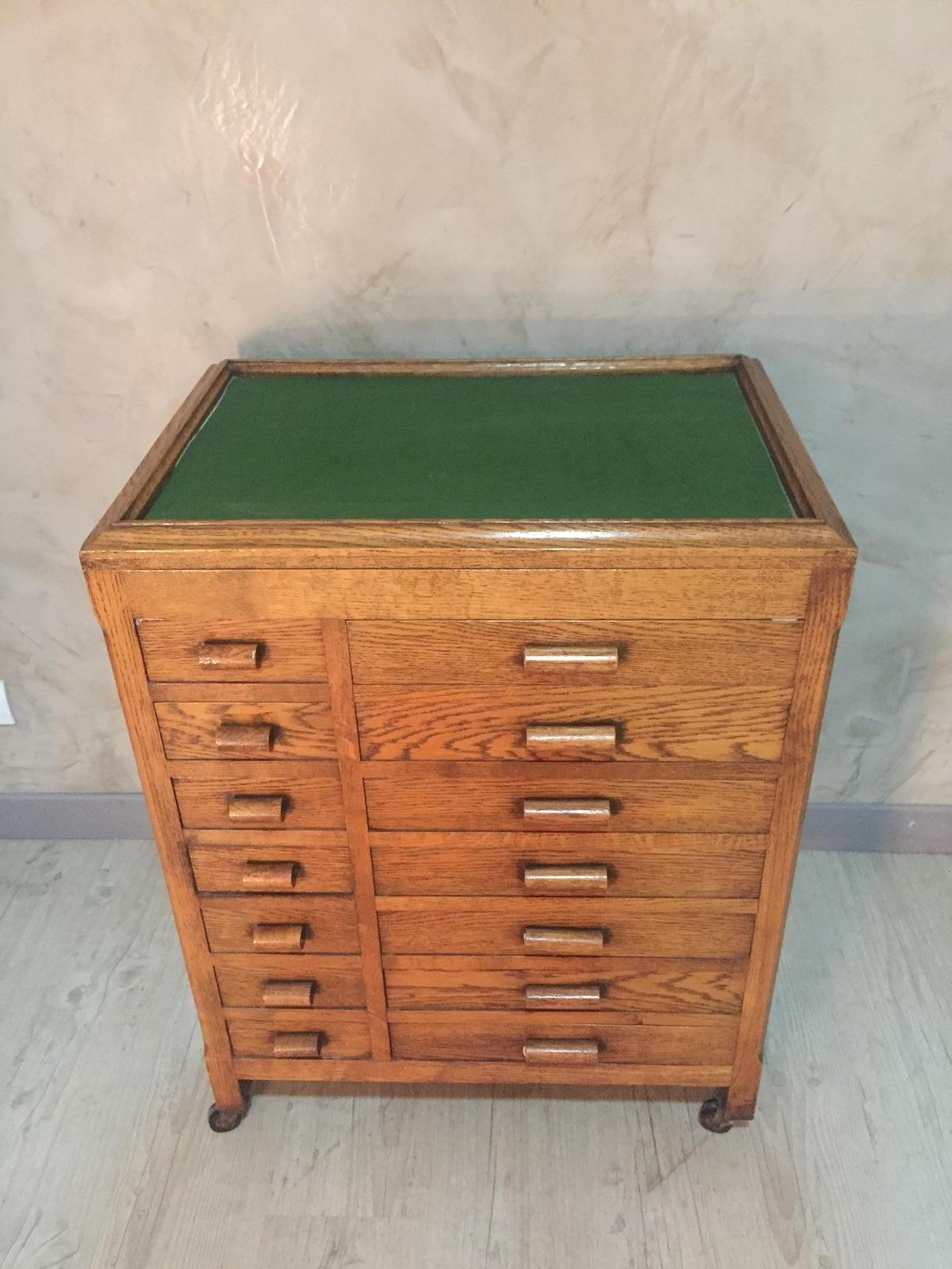 Very nice 20th century French oak workshop chest of drawers on wheels from the 1920s.
Good condition. Green velvet on the top. Many drawers. Paneled wood. Good quality.
  