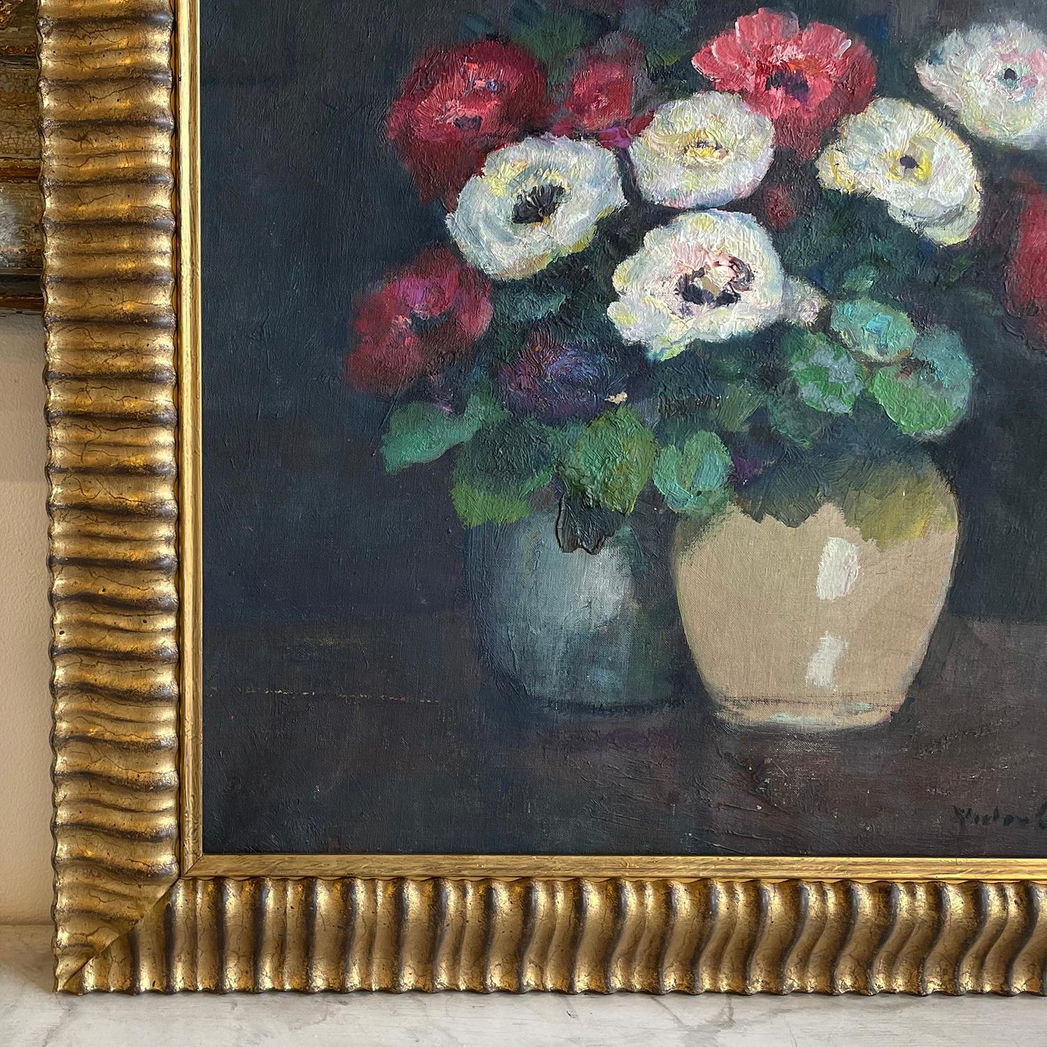 A French oil on canvas painting of two colorful vases with red and white anemones, flowers painted by Victor Charreton, in good condition. The blue and cream vases are standing on a wooden working table. The antique painting represents the 19th