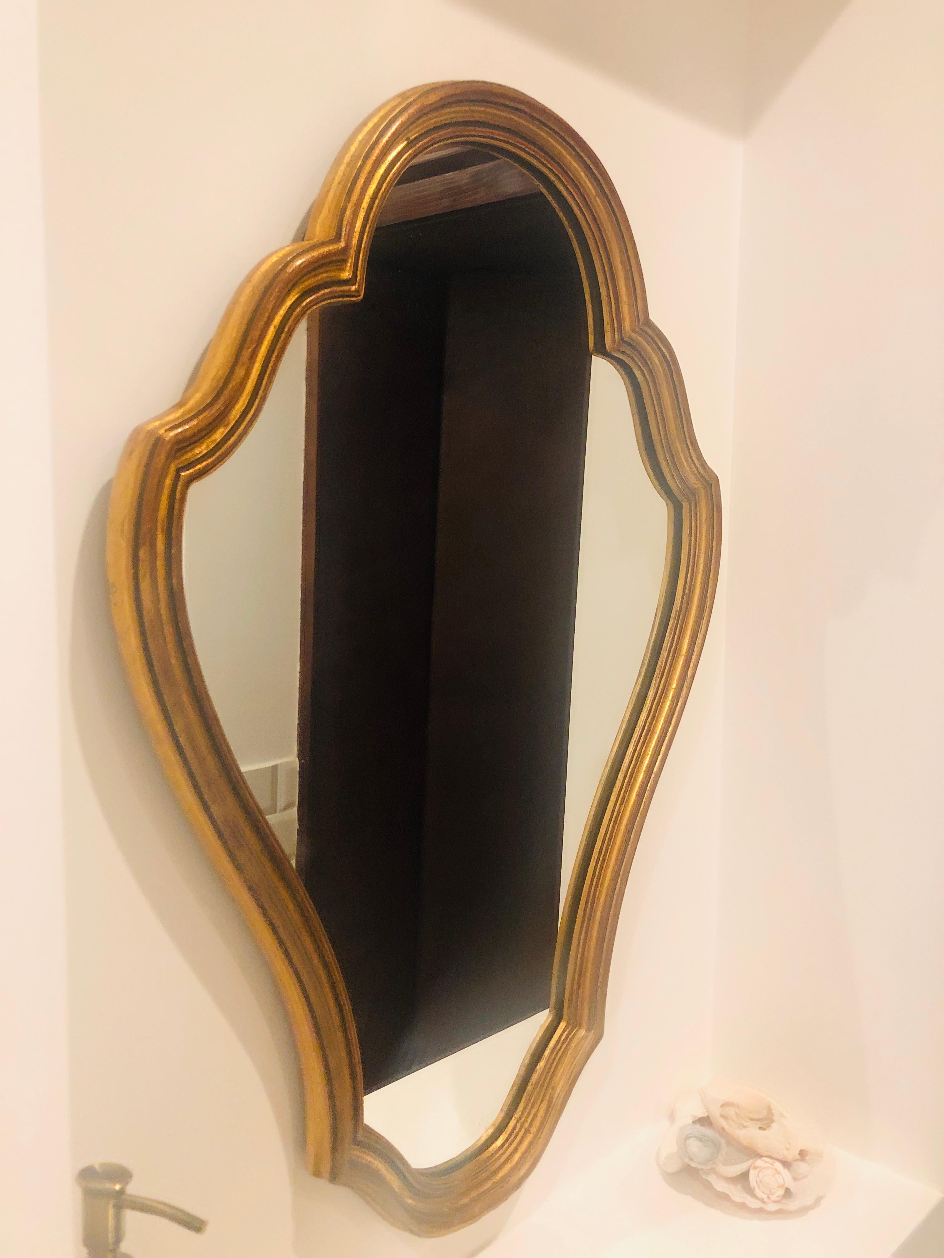 Giltwood mirror with original crystal glass in oval shape and in very good condition.
France, circa 1920.
