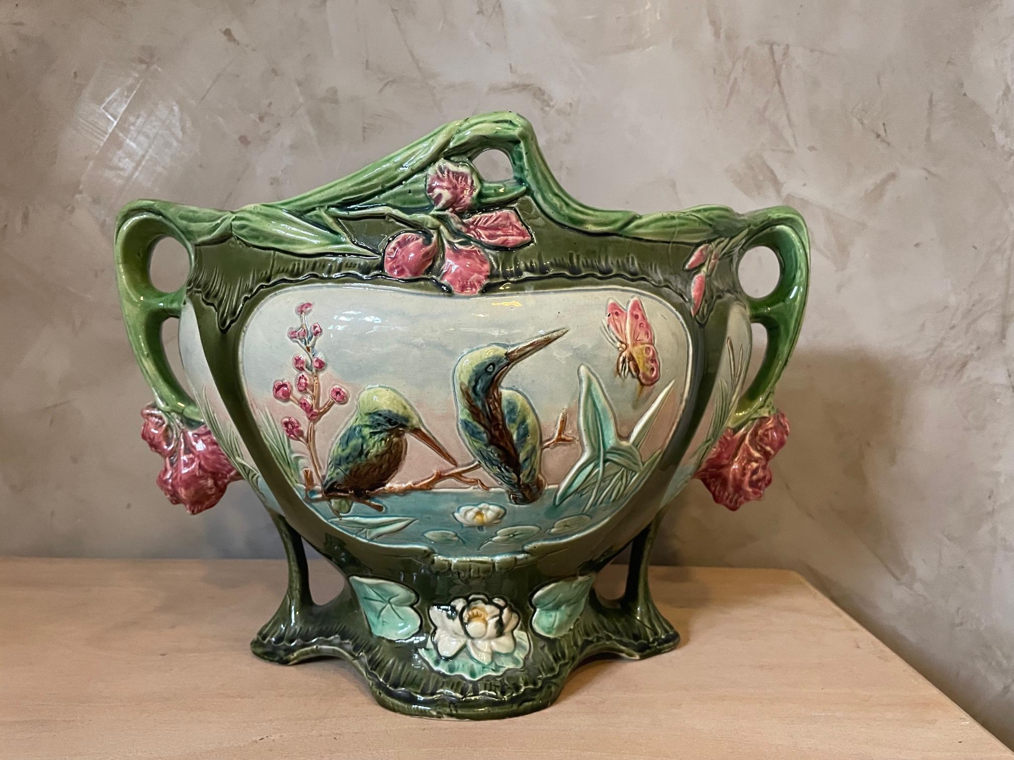 Beautiful 20th century French Painted Ceramic barbotine cachepot from the 1900s. Kingfisher and flower decoration. 
Very nice green and pink color. 
Good quality and condition. 