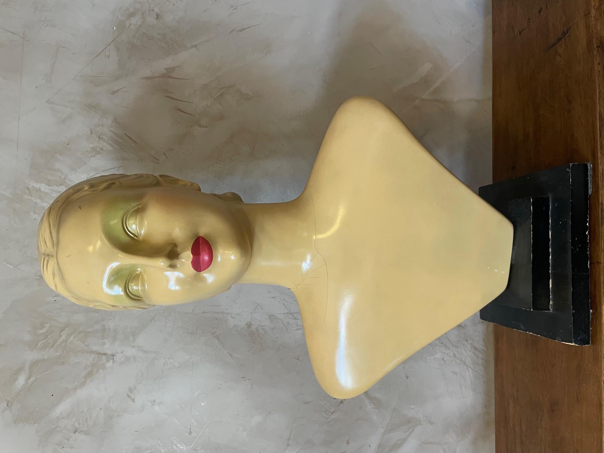 Very nice 20th century French painted fiberglass fashion bust, hold by a metal rod and on a wooden base. 
Some cracks at the neck but good general condition.